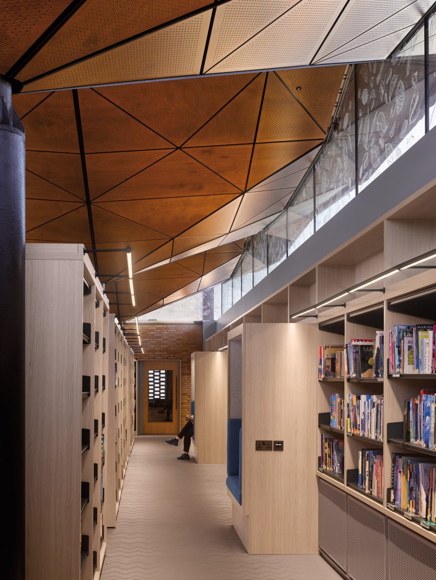 Formal library area has built in spaces for reading by Woods Bagot