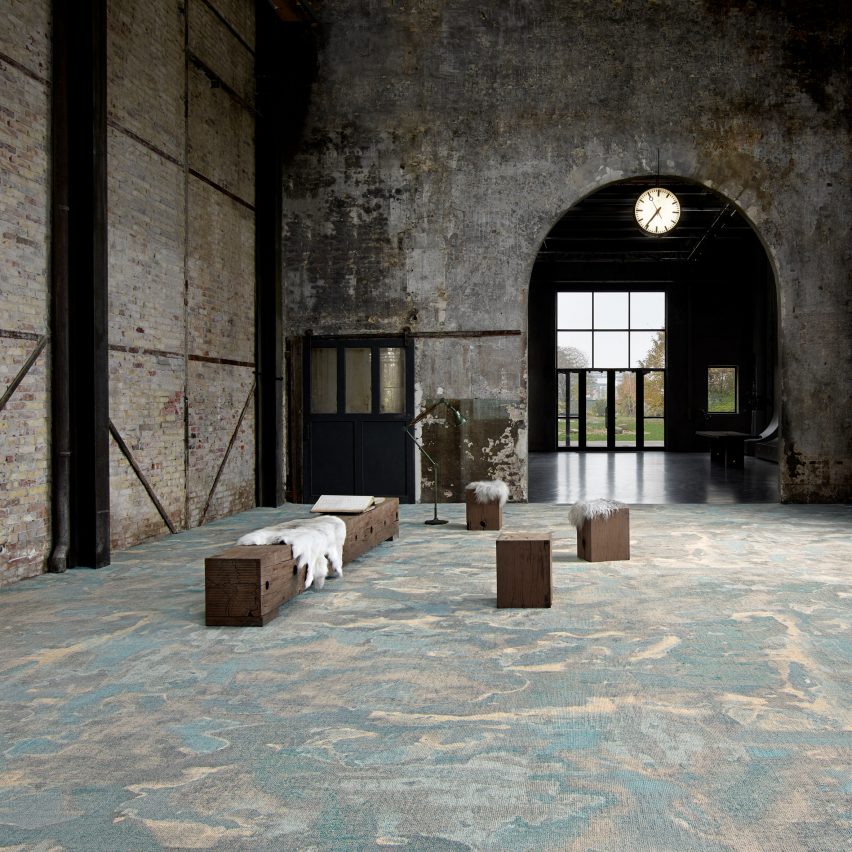 A marble-look carpet in a brick building