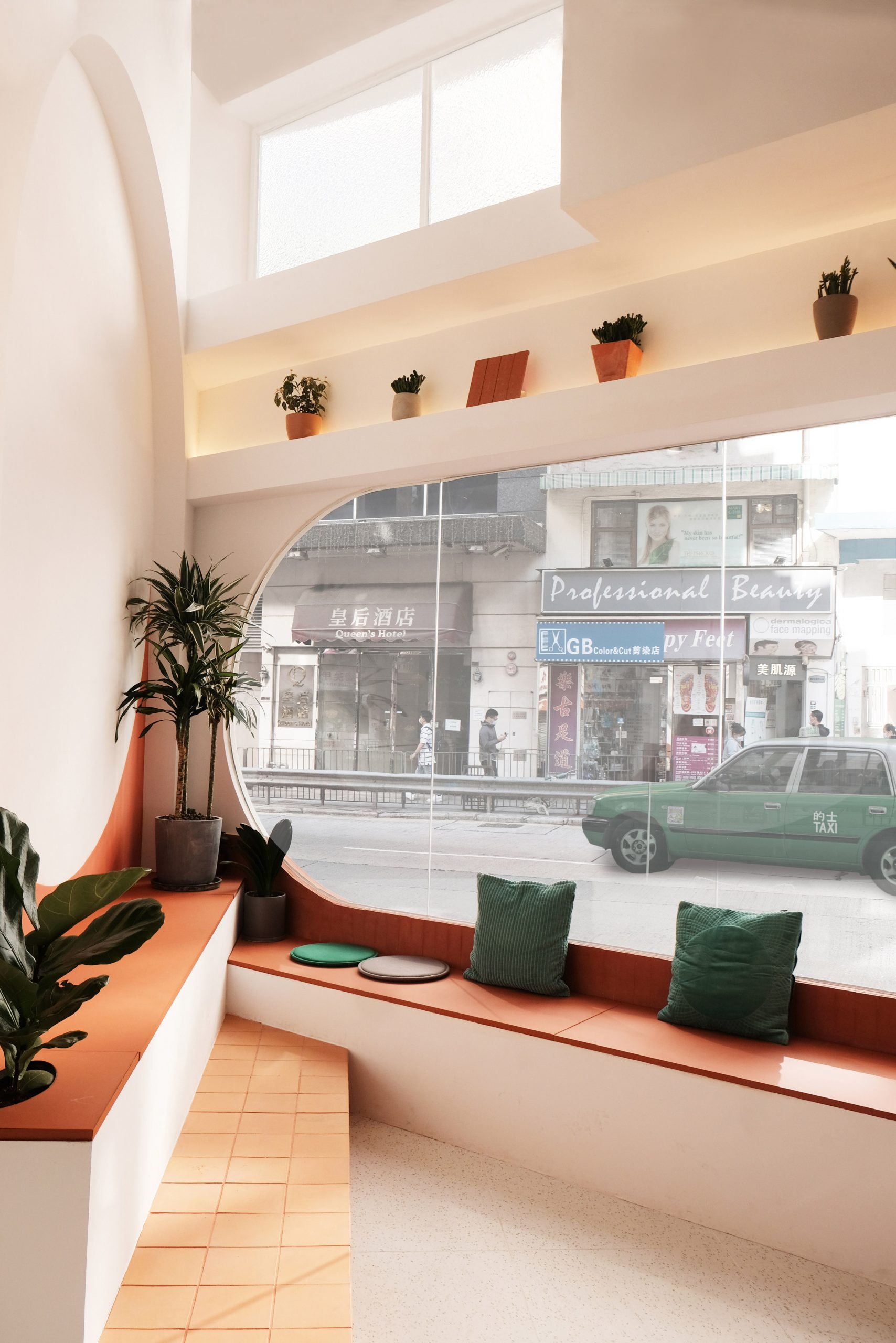 Rounded window and bench seating of Today is Long cafe by Studio Etain Ho and Absence from Island