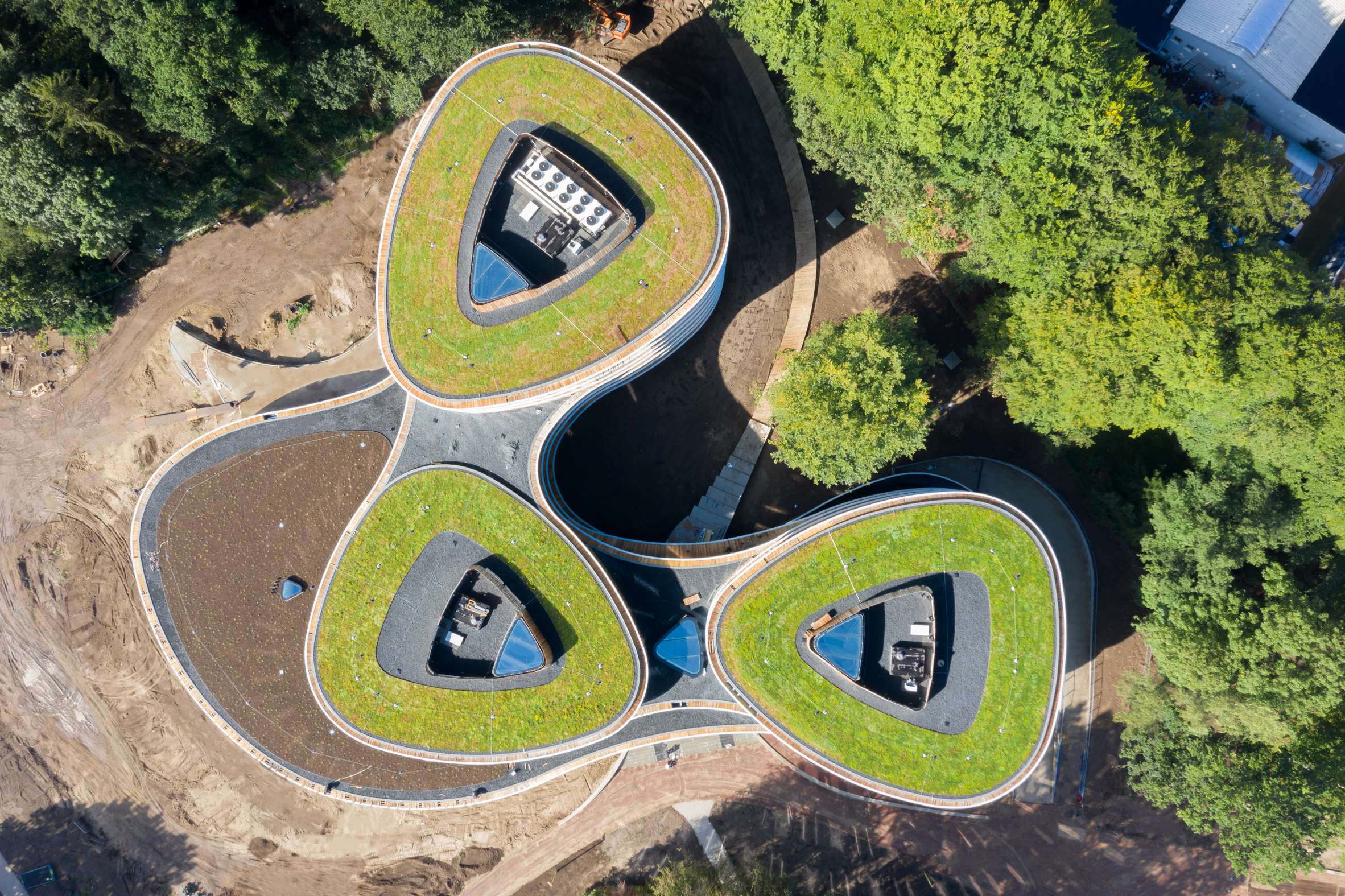An aerial view of a green-roofed office