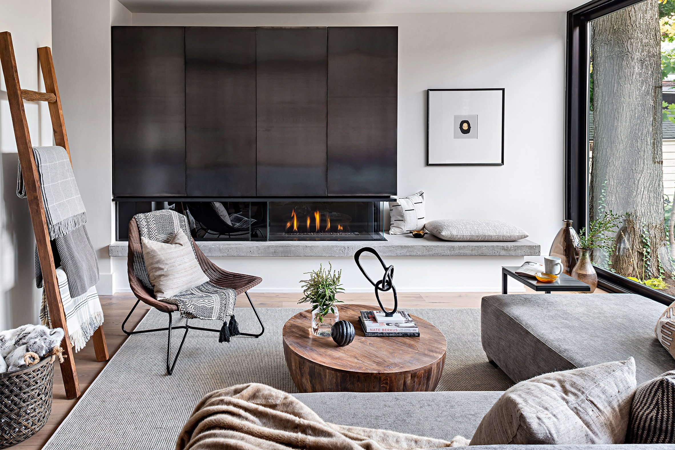 White living room with black fireplace