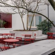 Red garden furniture fills the courtyard