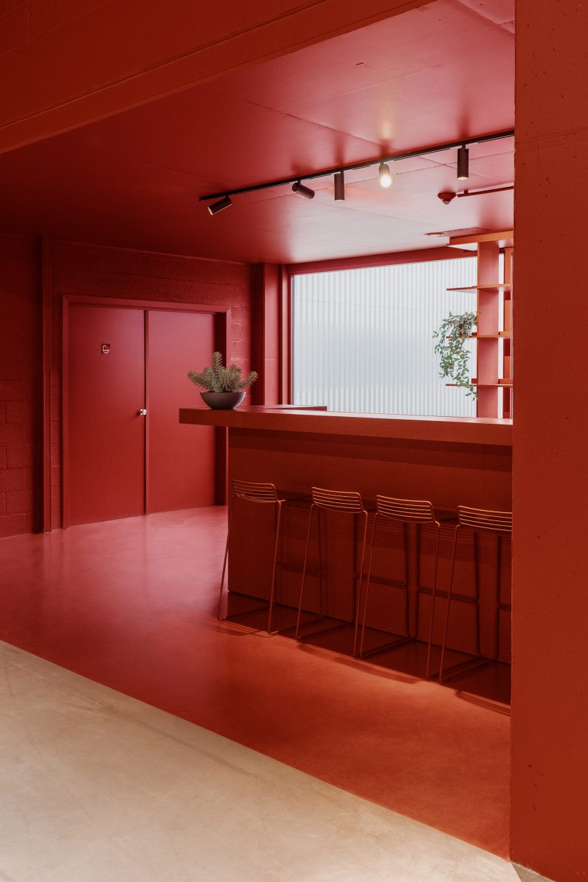 The bar area is painted red by Studio Anton Hendrik Denys