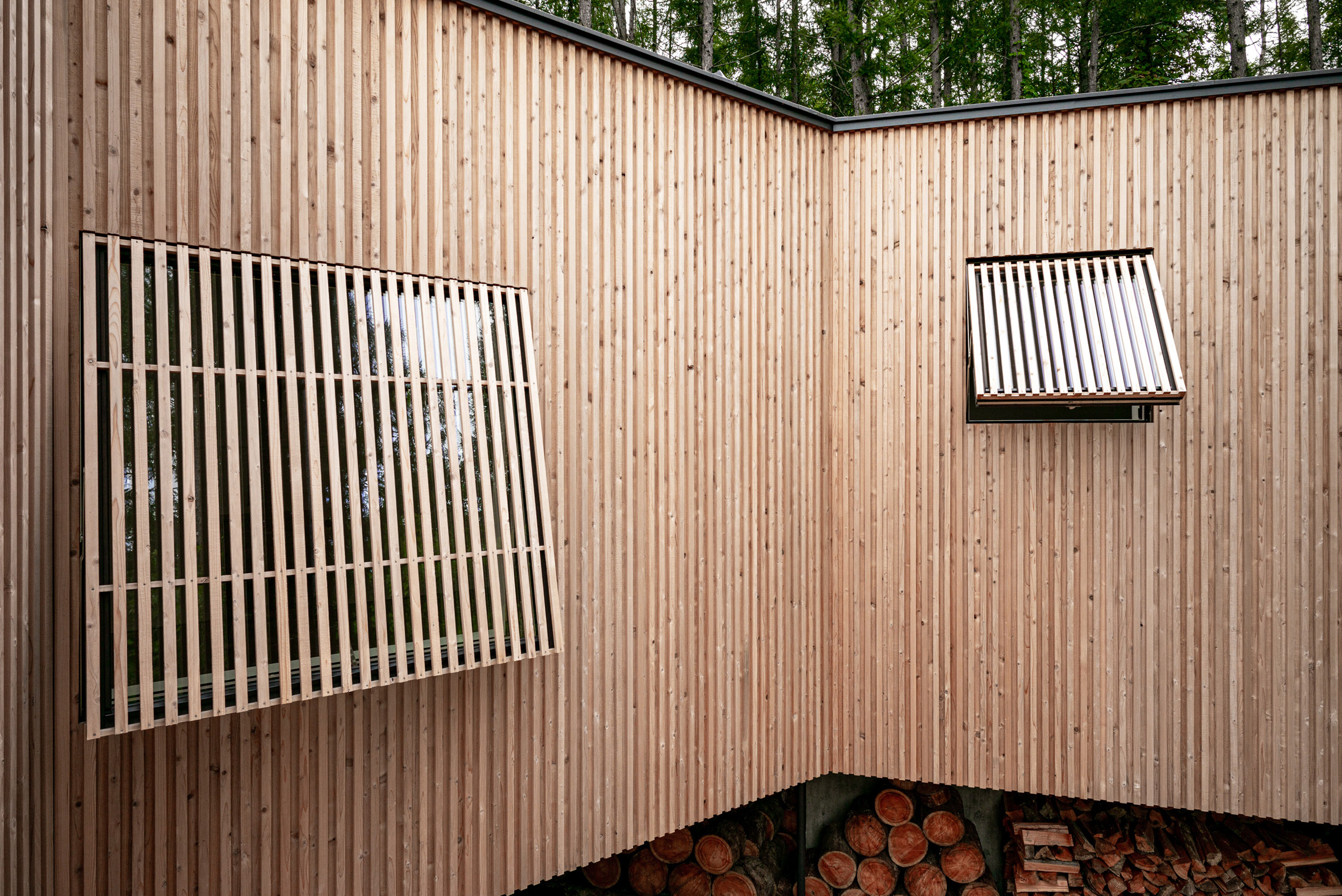 Wooden shade screens cover the windows by Florian Busch