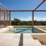 Rooftop pools crown holiday apartments in Tulum jungle by PPAA