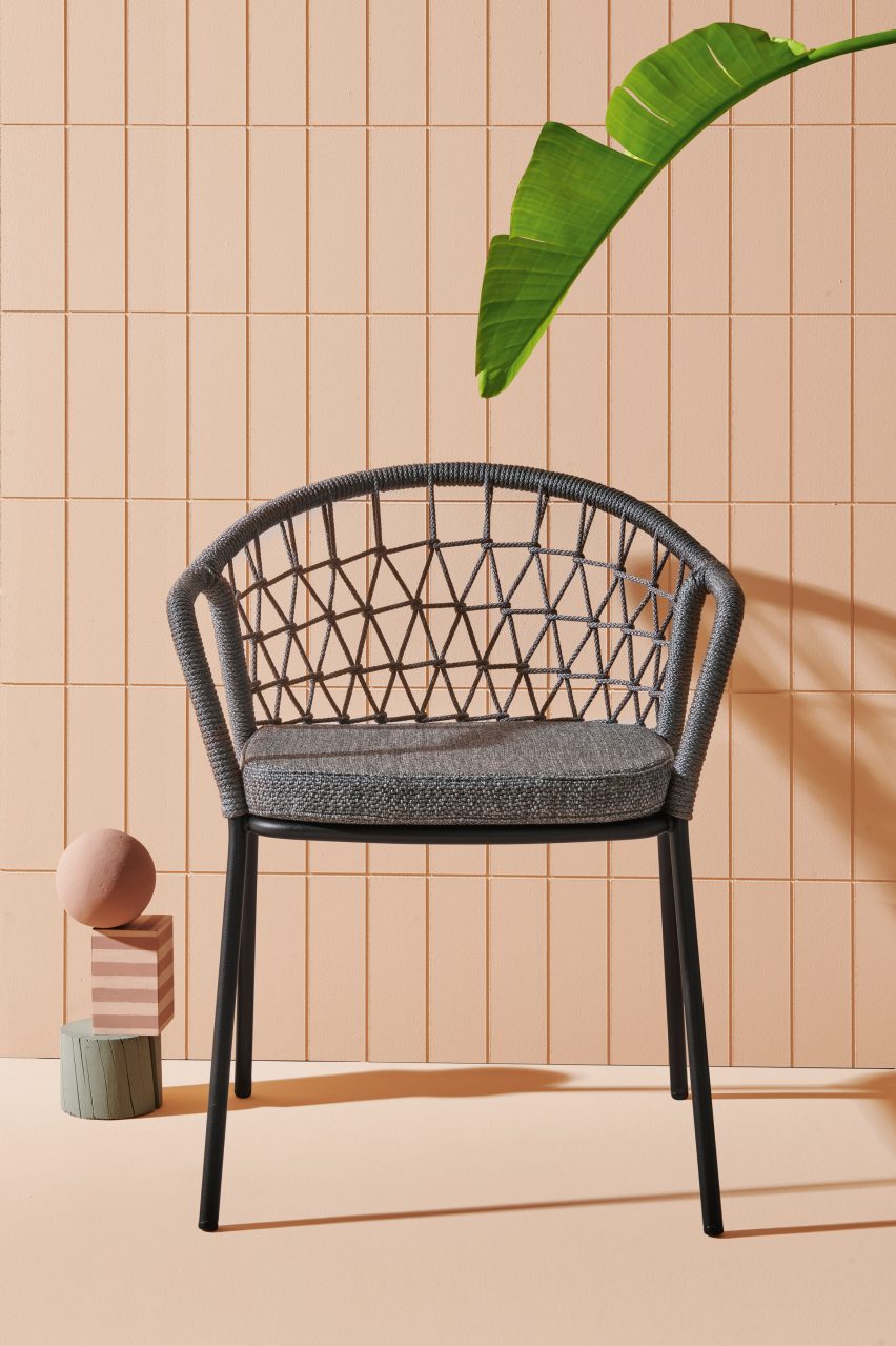 Grey chair with a hand woven backrest by CMP Design