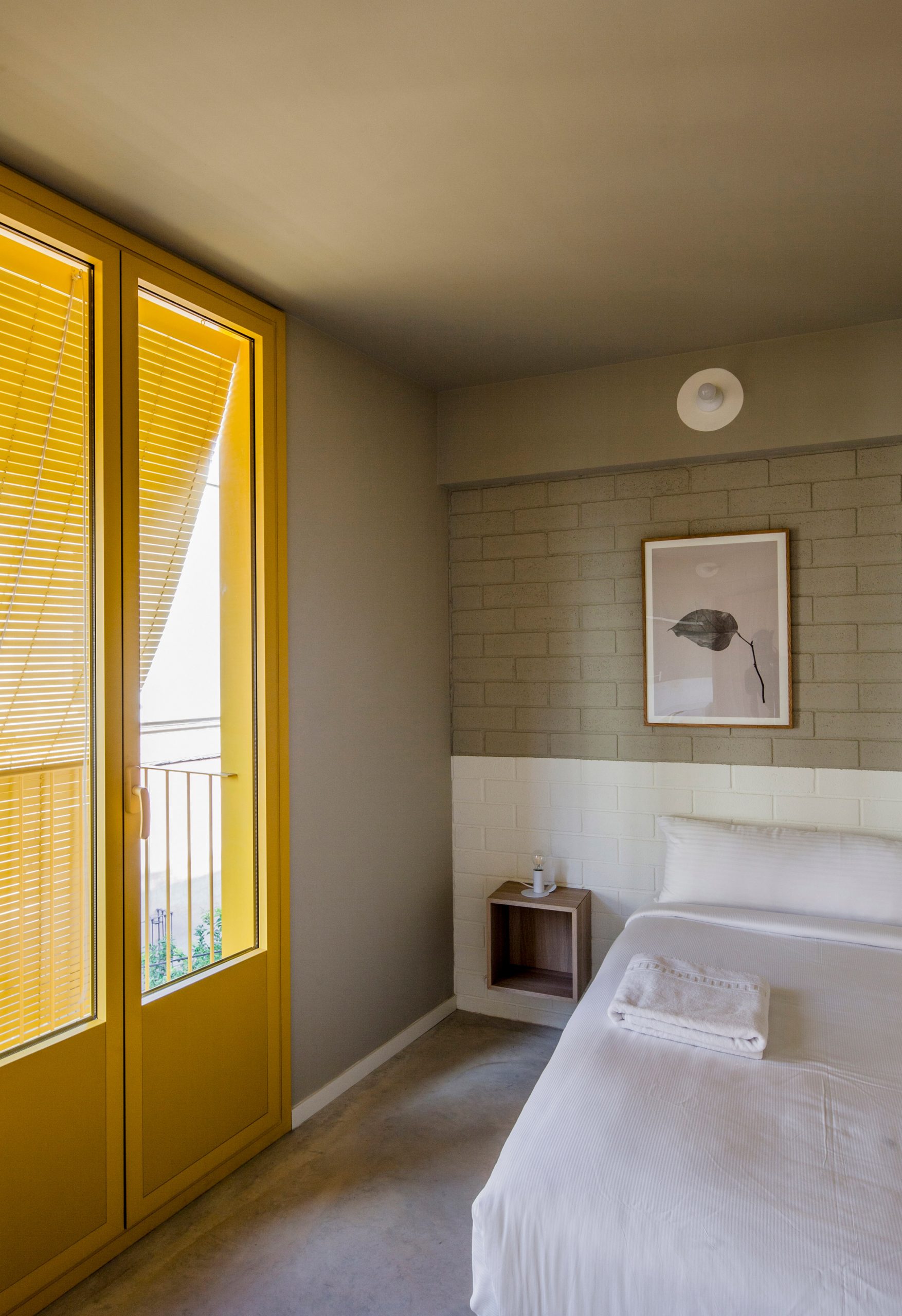 Yellow door frames and blinds provide privacy