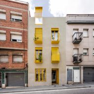 Anna and Eugeni Bach create Barcelona apartment building with bright yellow balconies