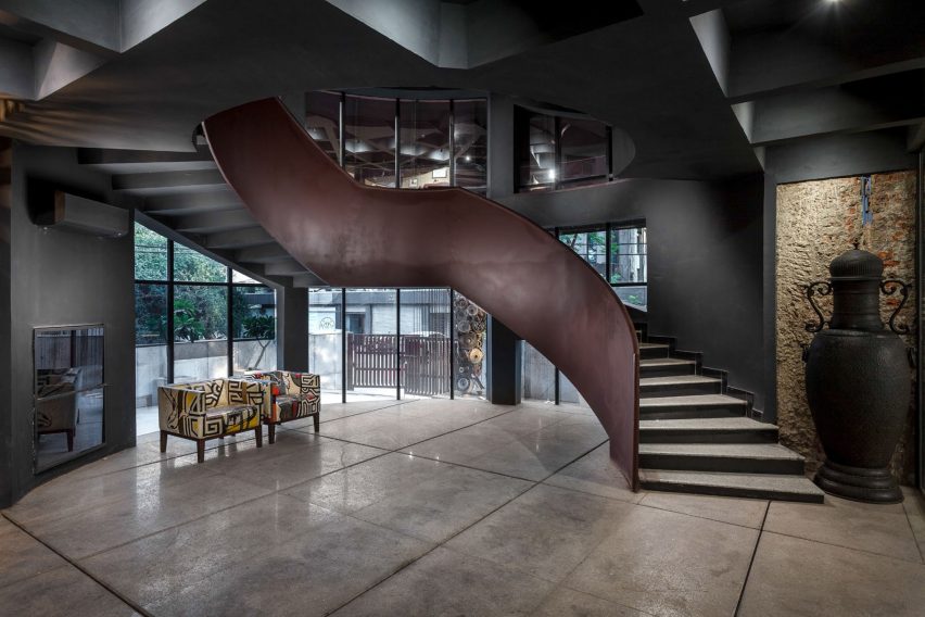 The staircase has a weathered steel finish by Architecture Discipline