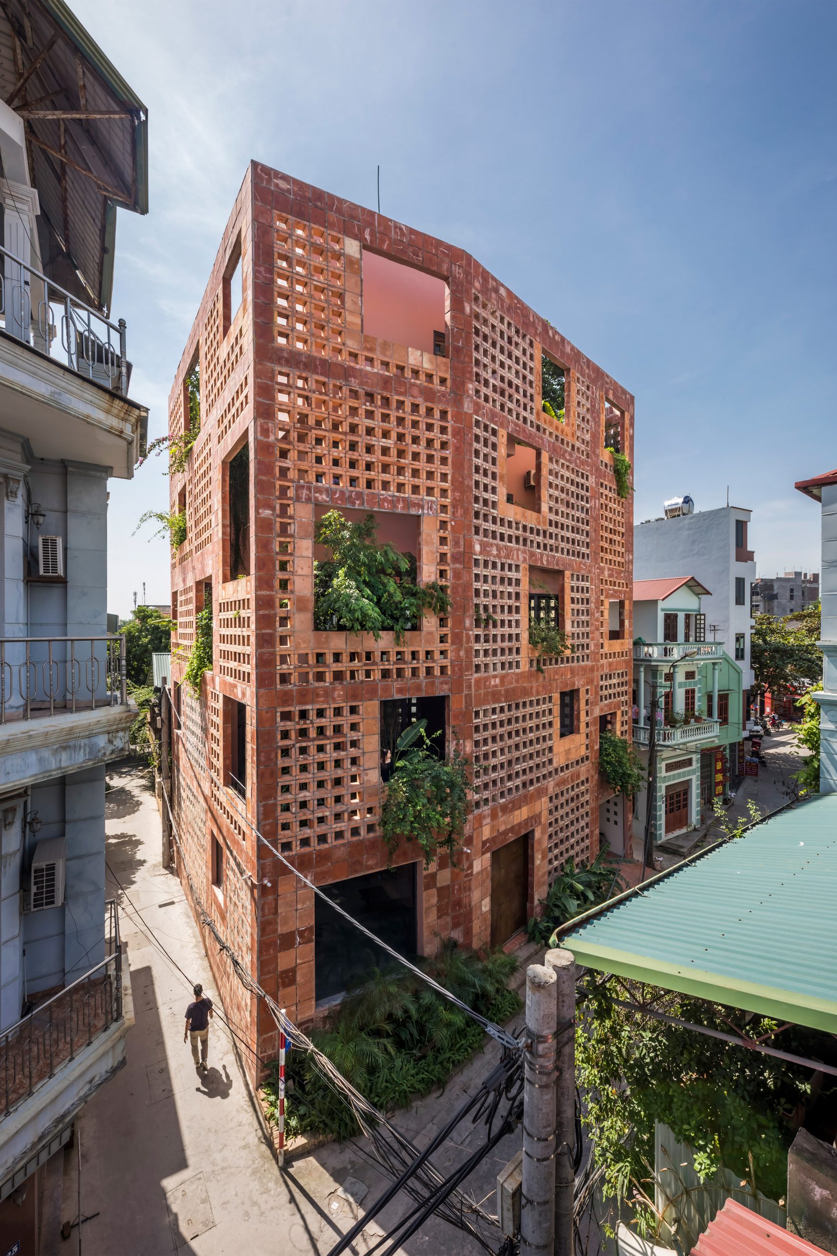 The house has a ceramic brick exterior by Vo Trong Nghia Architects