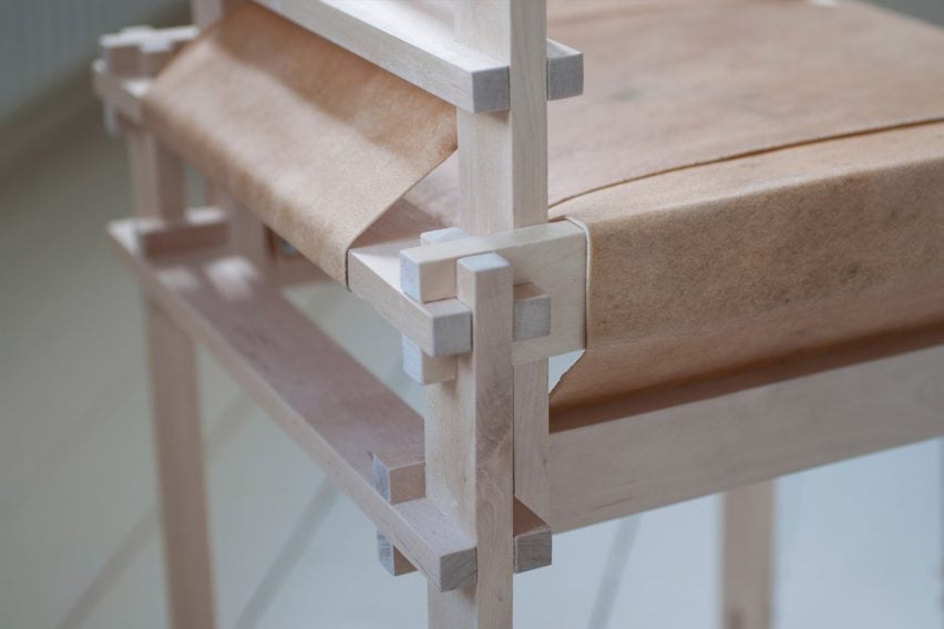 Close-up of wooden chair by Martin Thübeck wrapped in raw cowhide