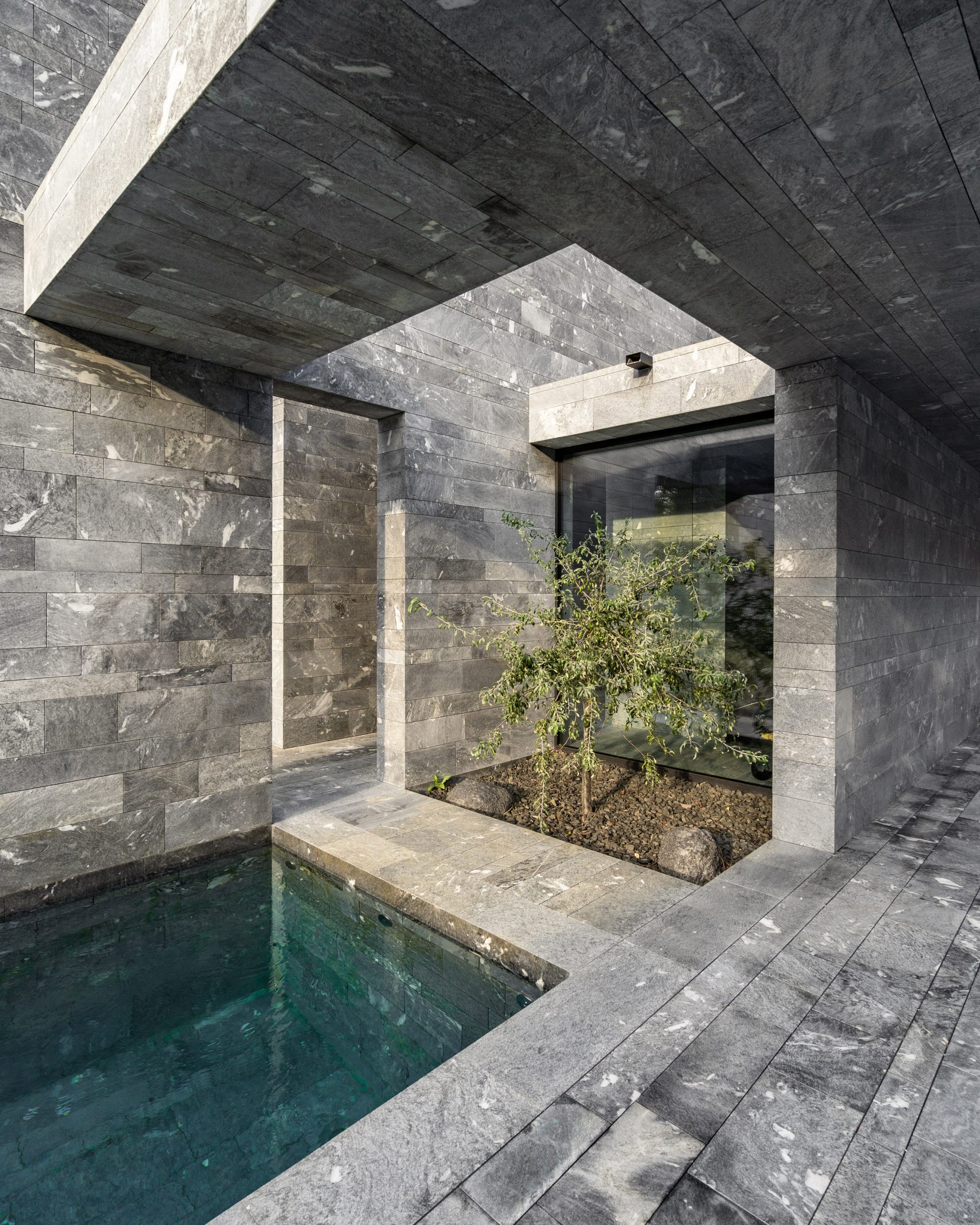 The stone-walled interiors of monolithic private spa