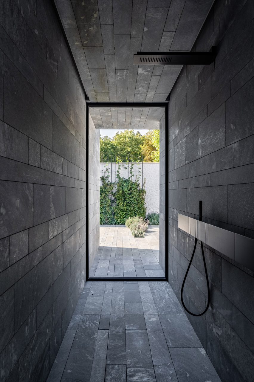 A stone-walled shower room inside a private spa