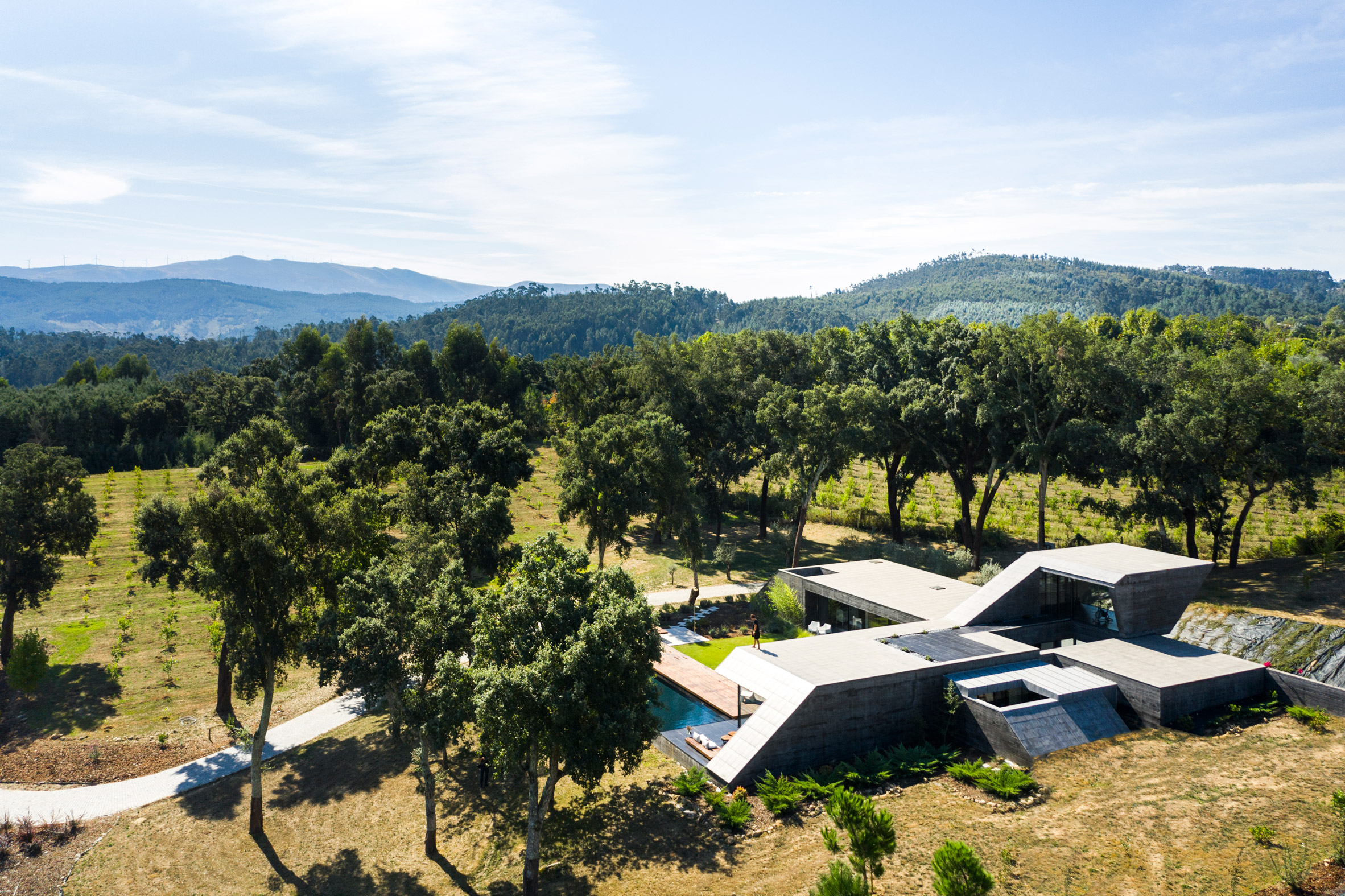 An angular concrete house built on a Portuguese hilltop