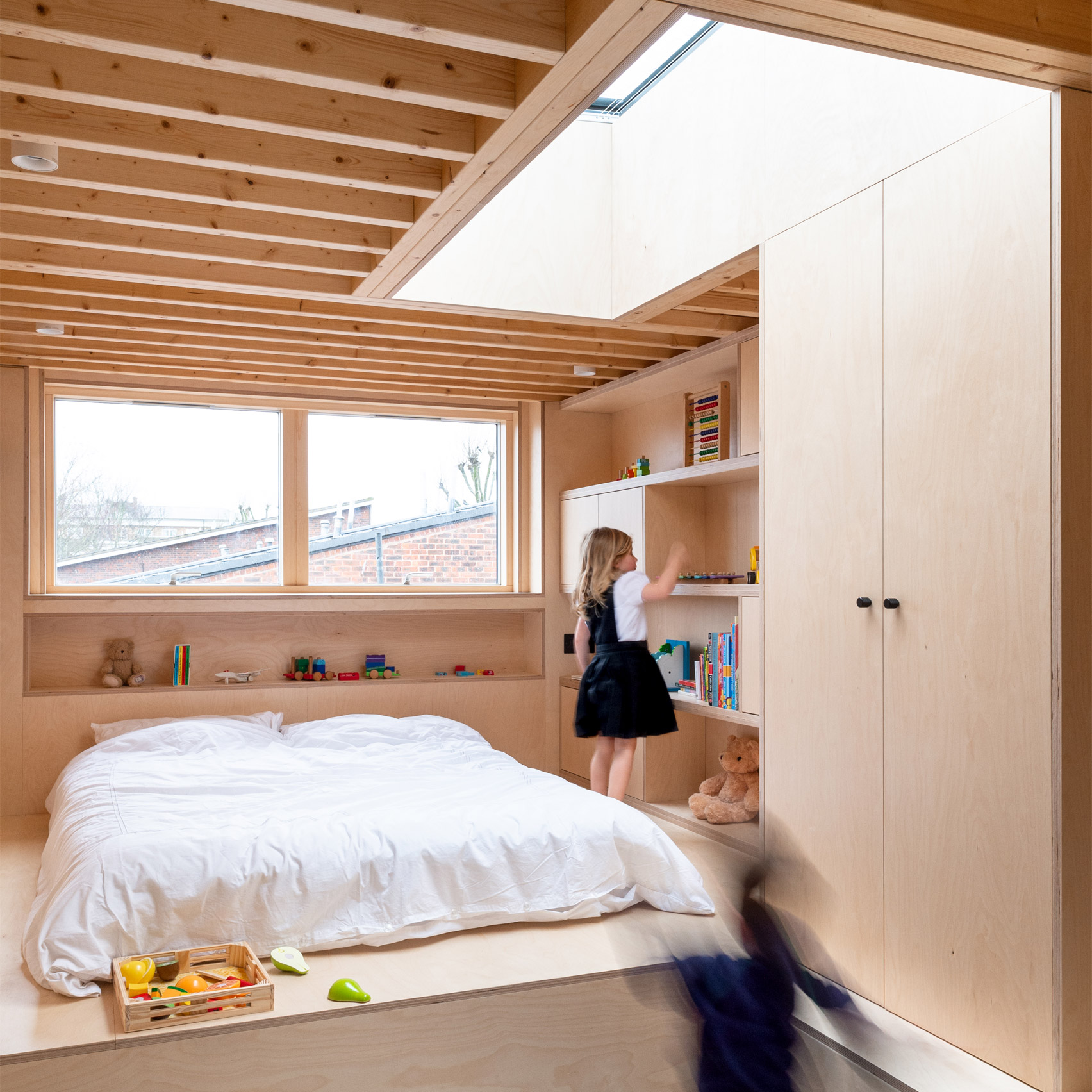 A wood-lined children's bedroom