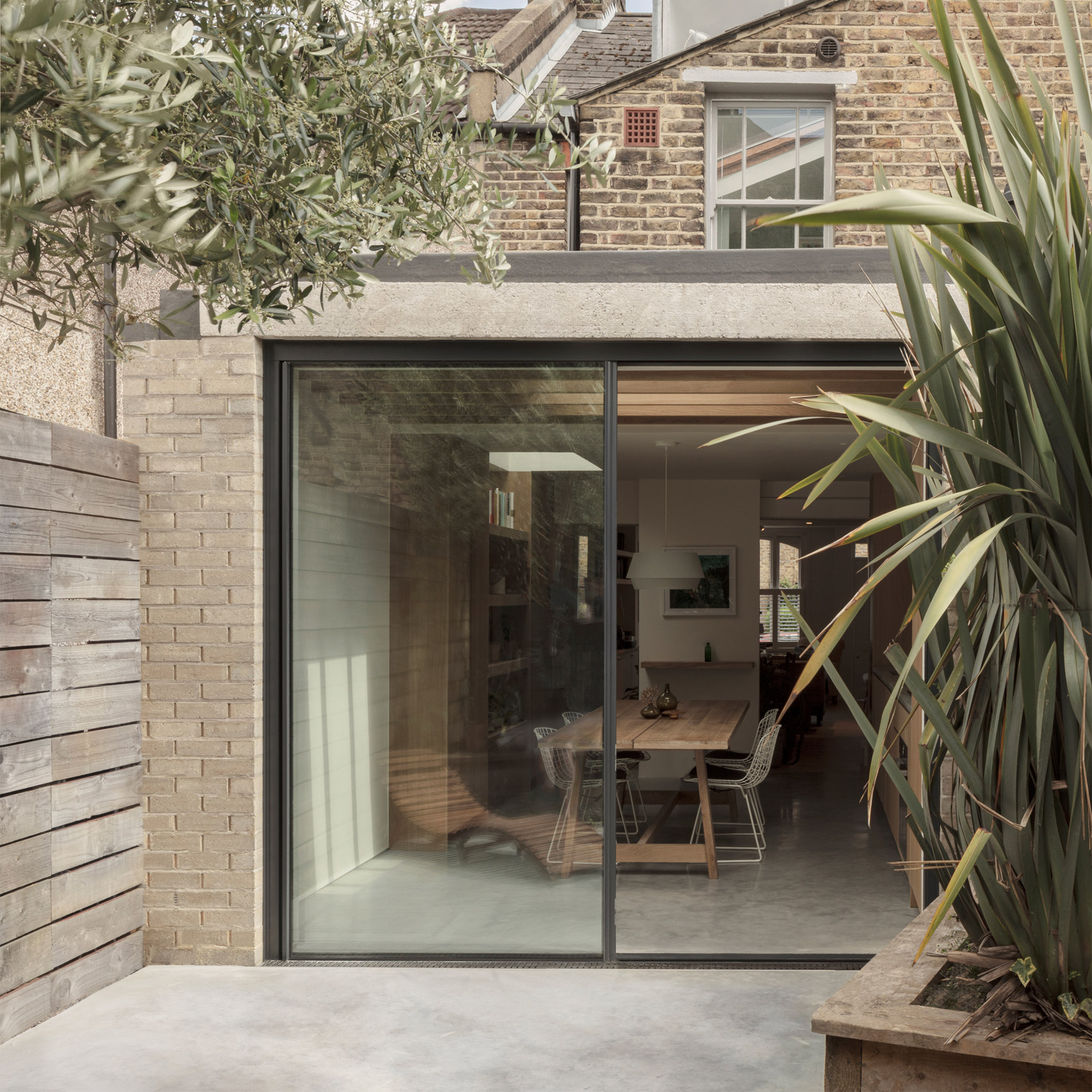 A small light-brick residential extension 