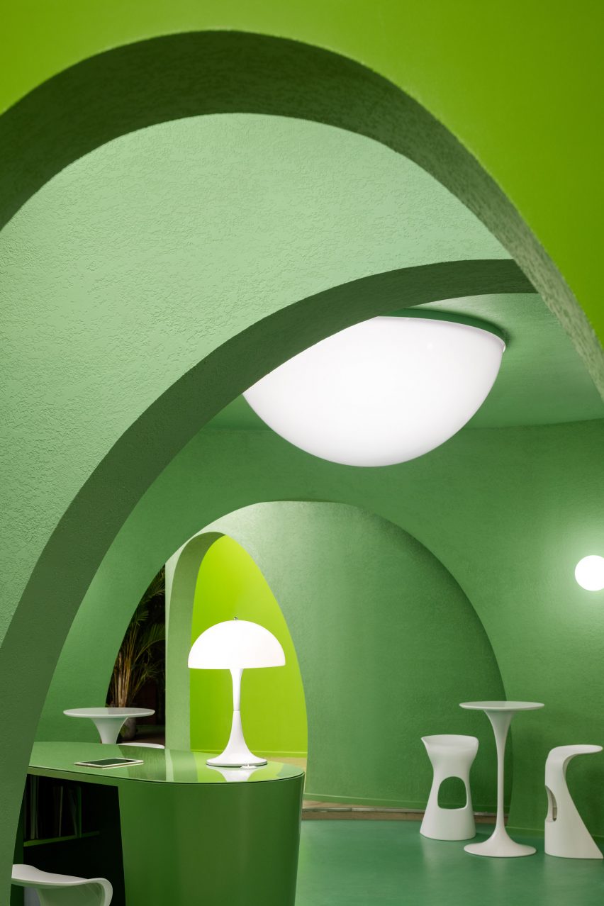 Walls are curved and have arches by IS architecture and design