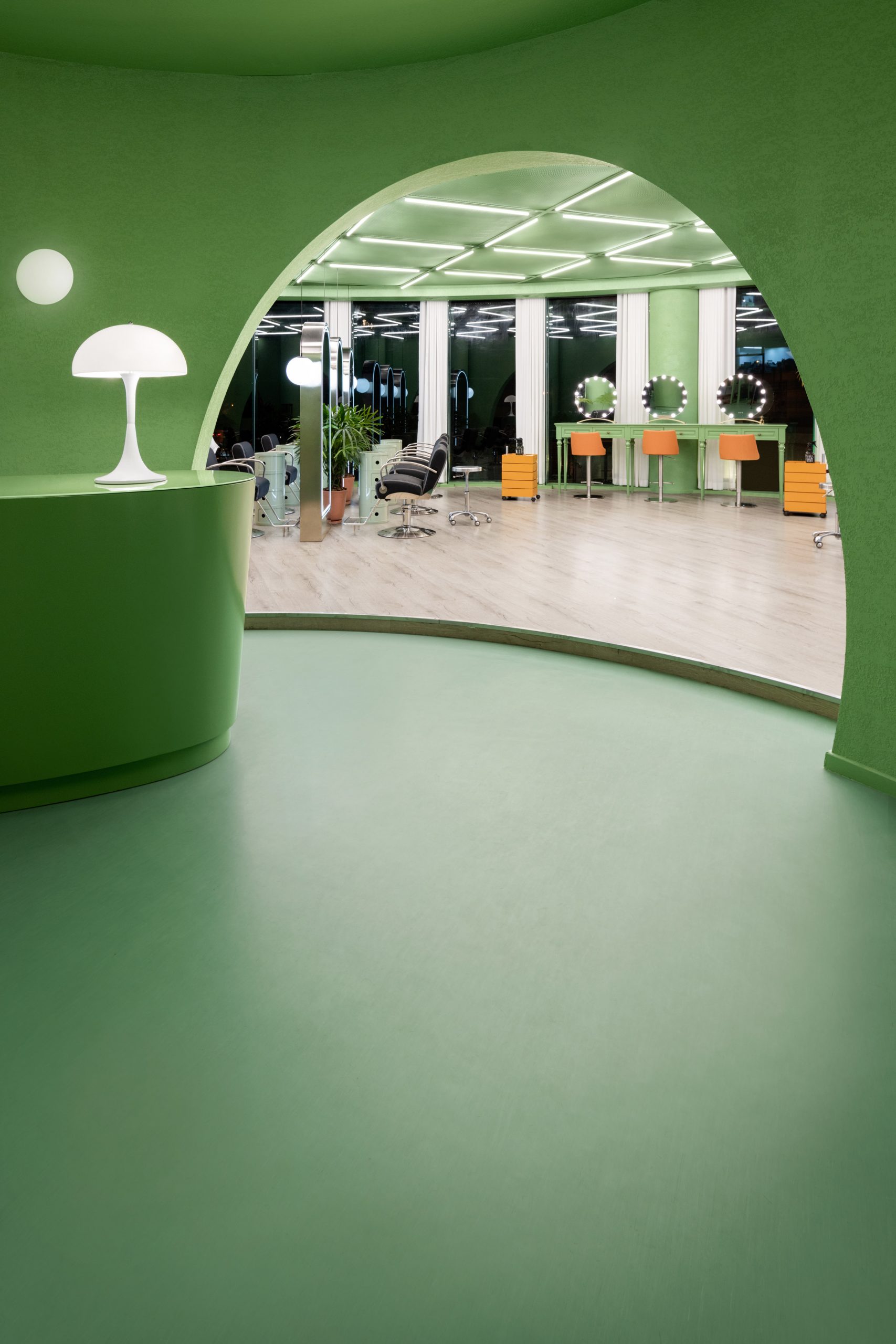 The lobby has a synthetic green floor by IS architecture and design