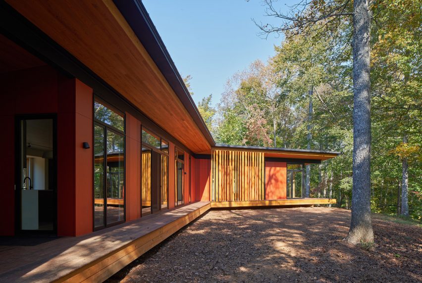 Stained cypress wood on exterior of house in the woods