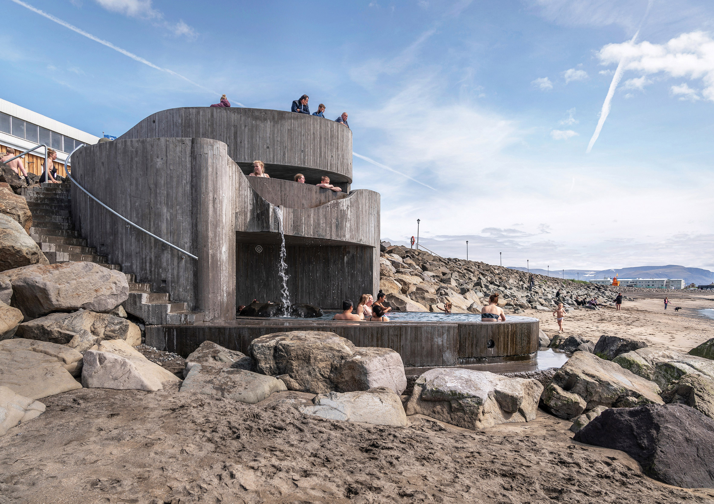 Beach view of Guðlaug Baths by Basalt Architects
