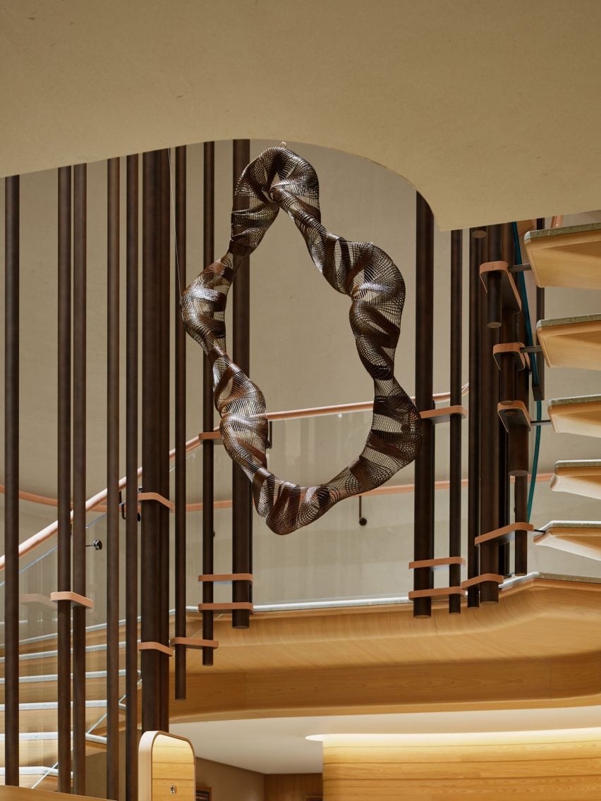 A suspended sculpture in a staircase