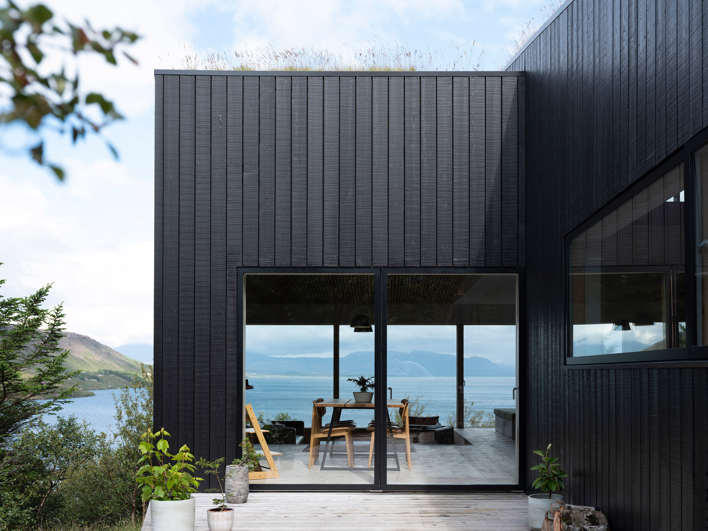 A blackened-wood holiday home overlooking Lake Thingvallavatn