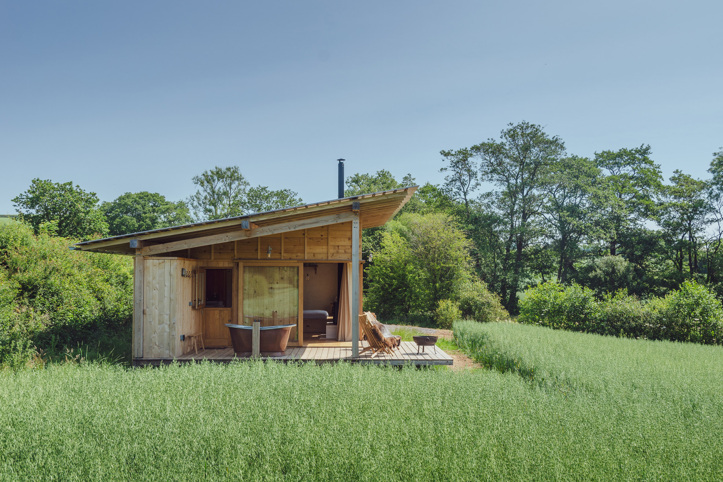 A cedar-clad cabin in English farmland