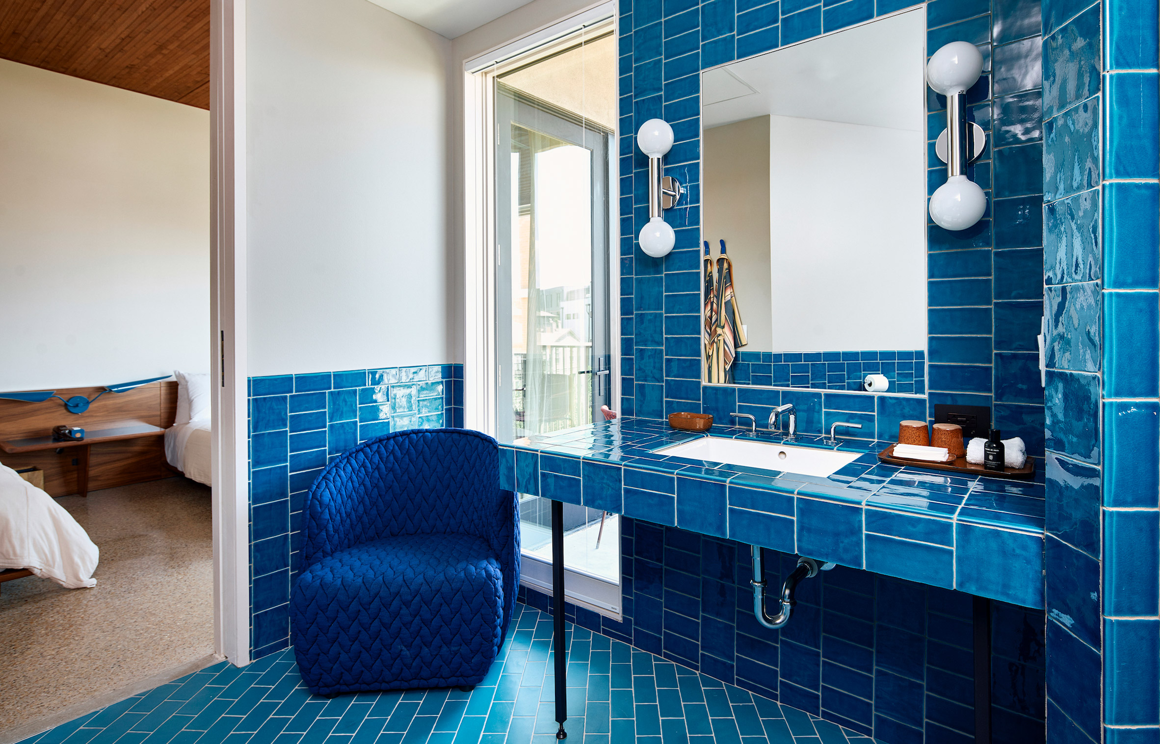A blue tiled bathroom