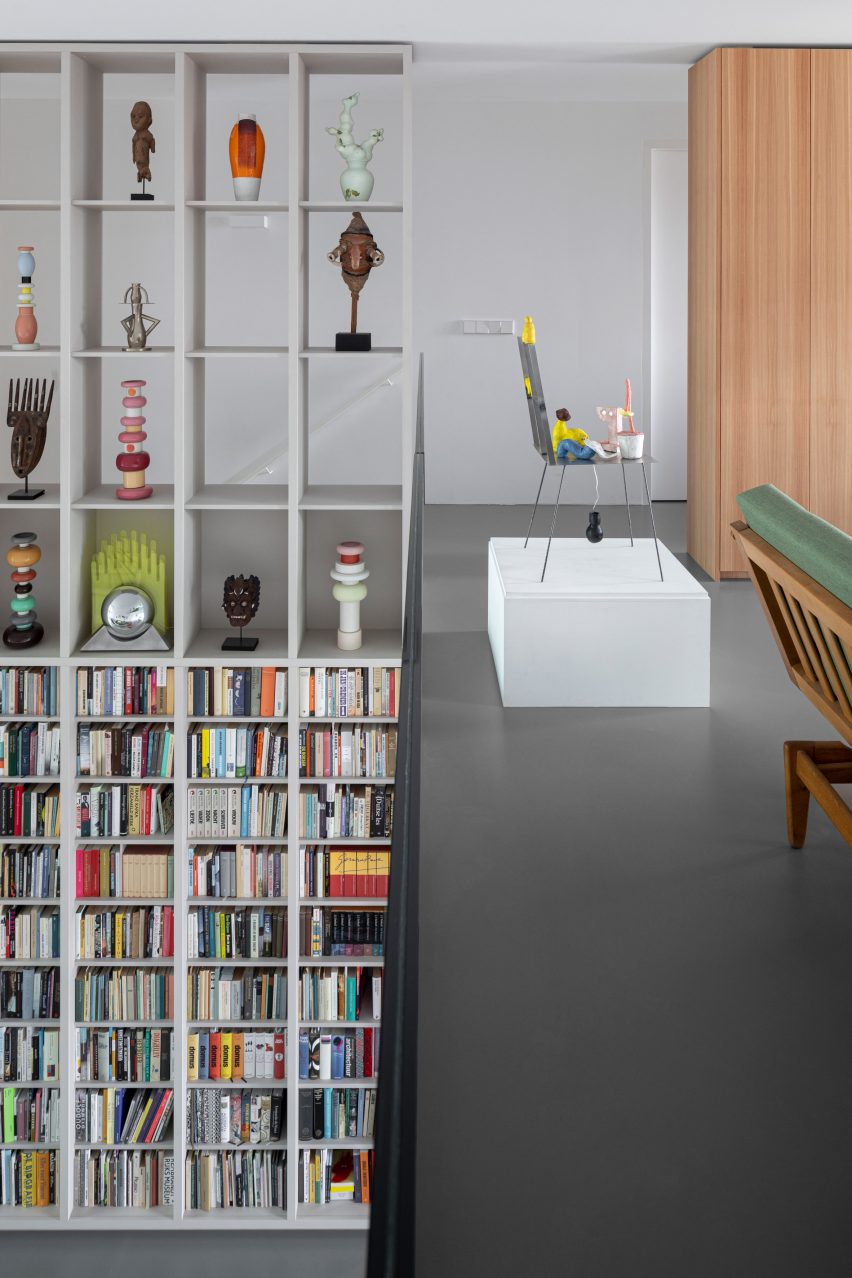 Open shelving displaying books and art in Amsterdam apartment