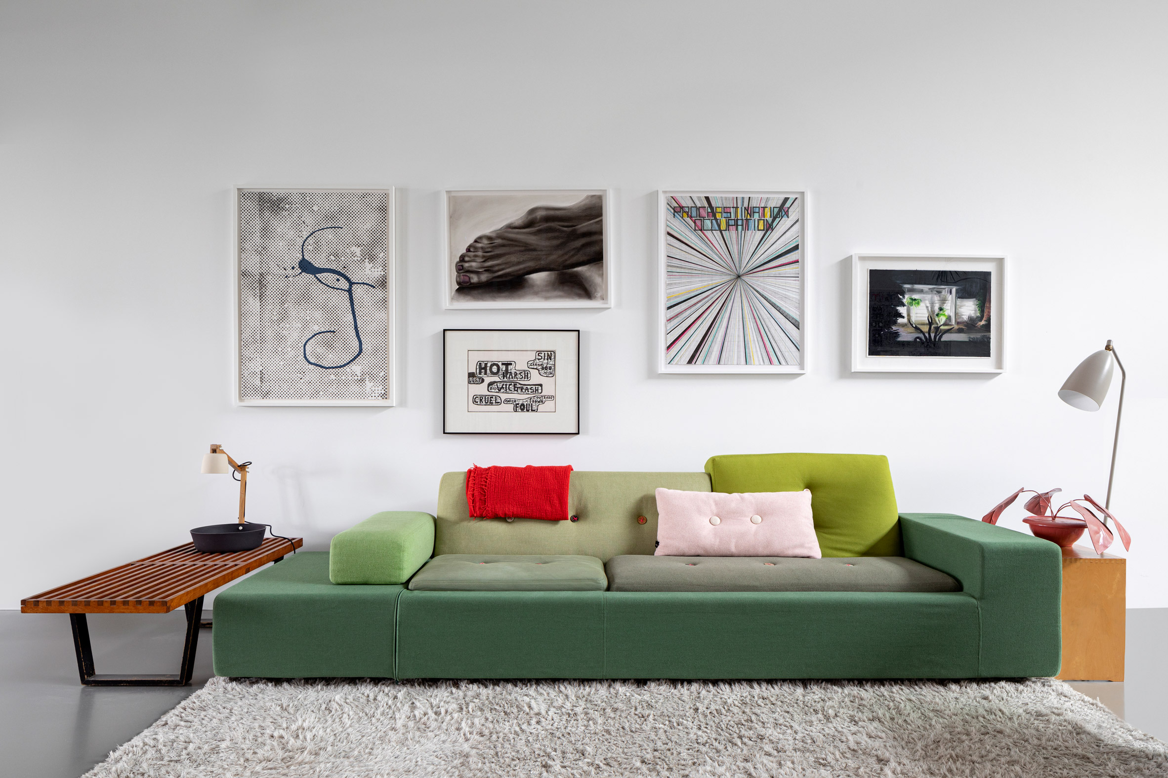 Green sofa with feature wall in Amsterdam apartment