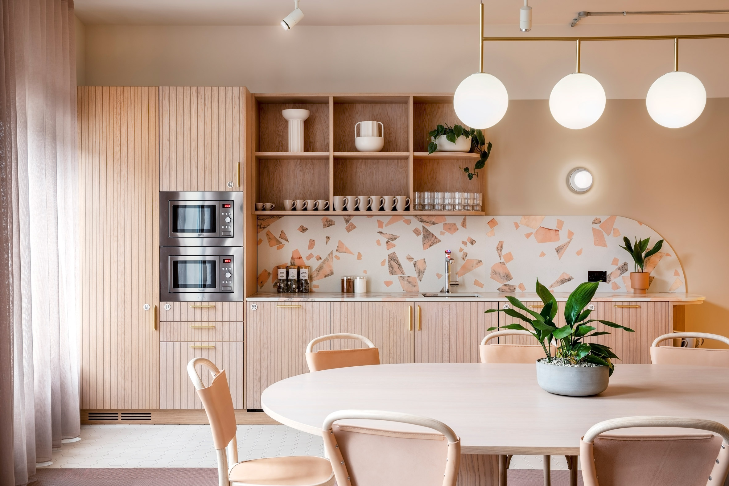 Pale pink kitchen with terrazzo details