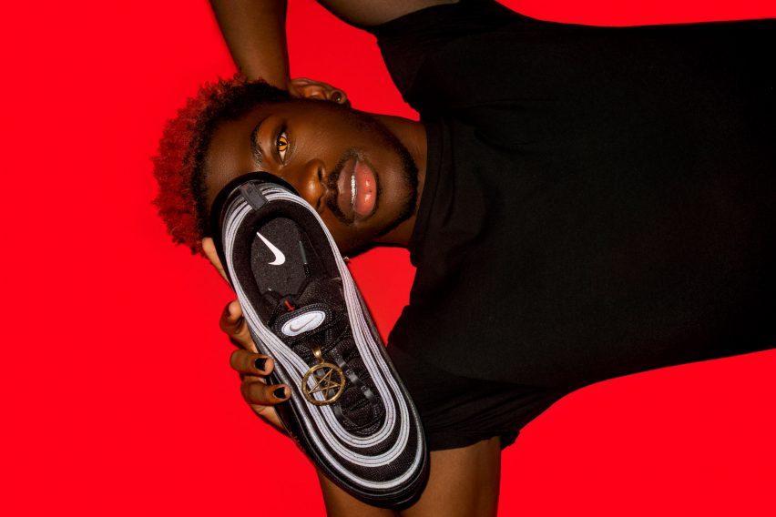 Lil NAs X posing with one of the Satan Shoes
