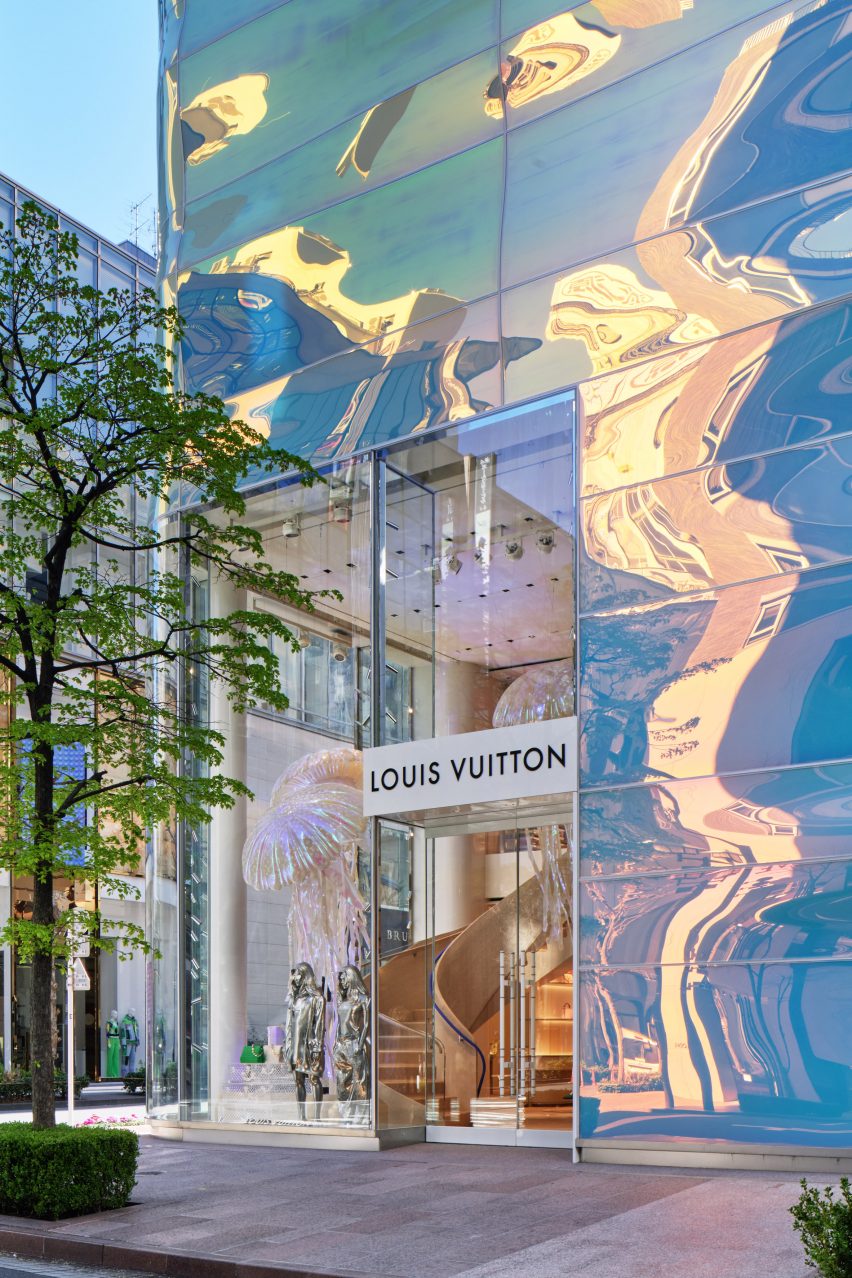 An opening in the facade marks the entrance to the Louis Vuitton store