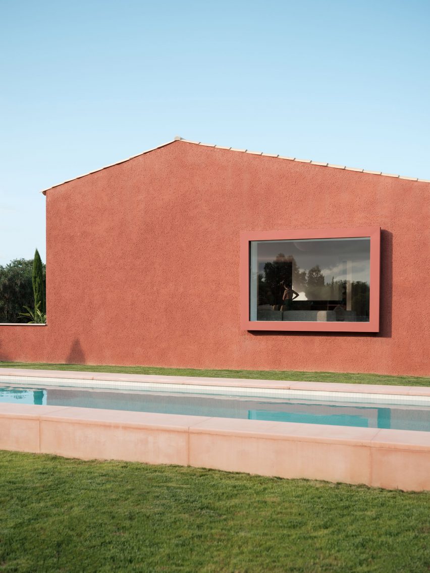 The red-coloured facade of a holiday home in Mallorca