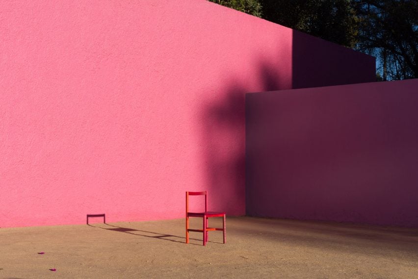 Multicoloured Grana chair by Moisés Hernández in front of pink wall