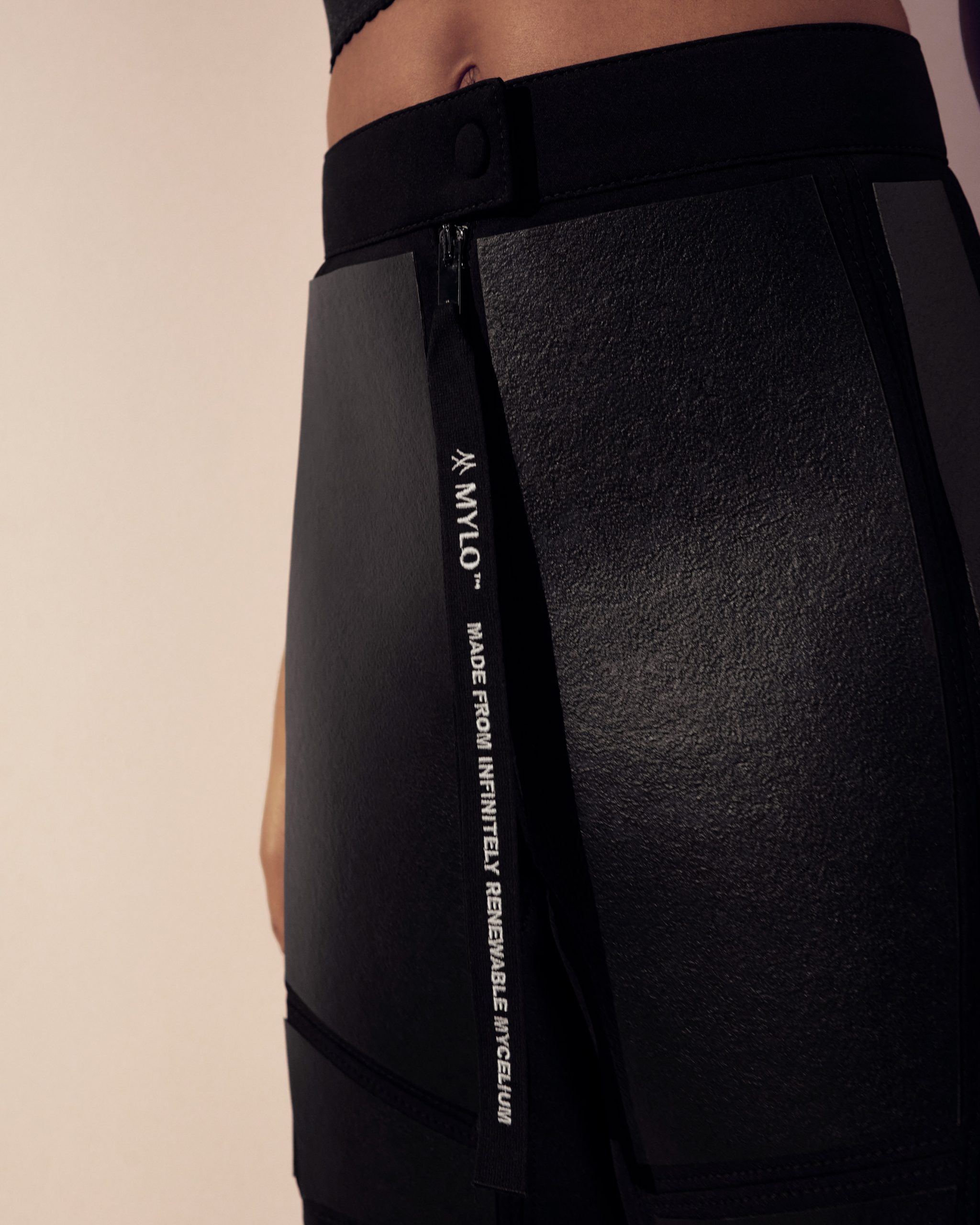 Close-up of Mylo leather on black trousers