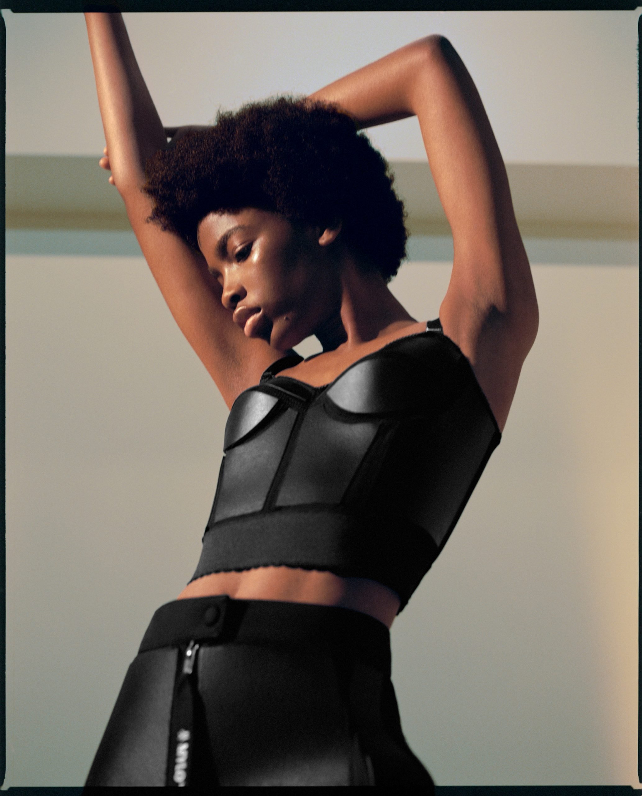 Model wearing black two-piece made from mycelium leather by Stella McCartney