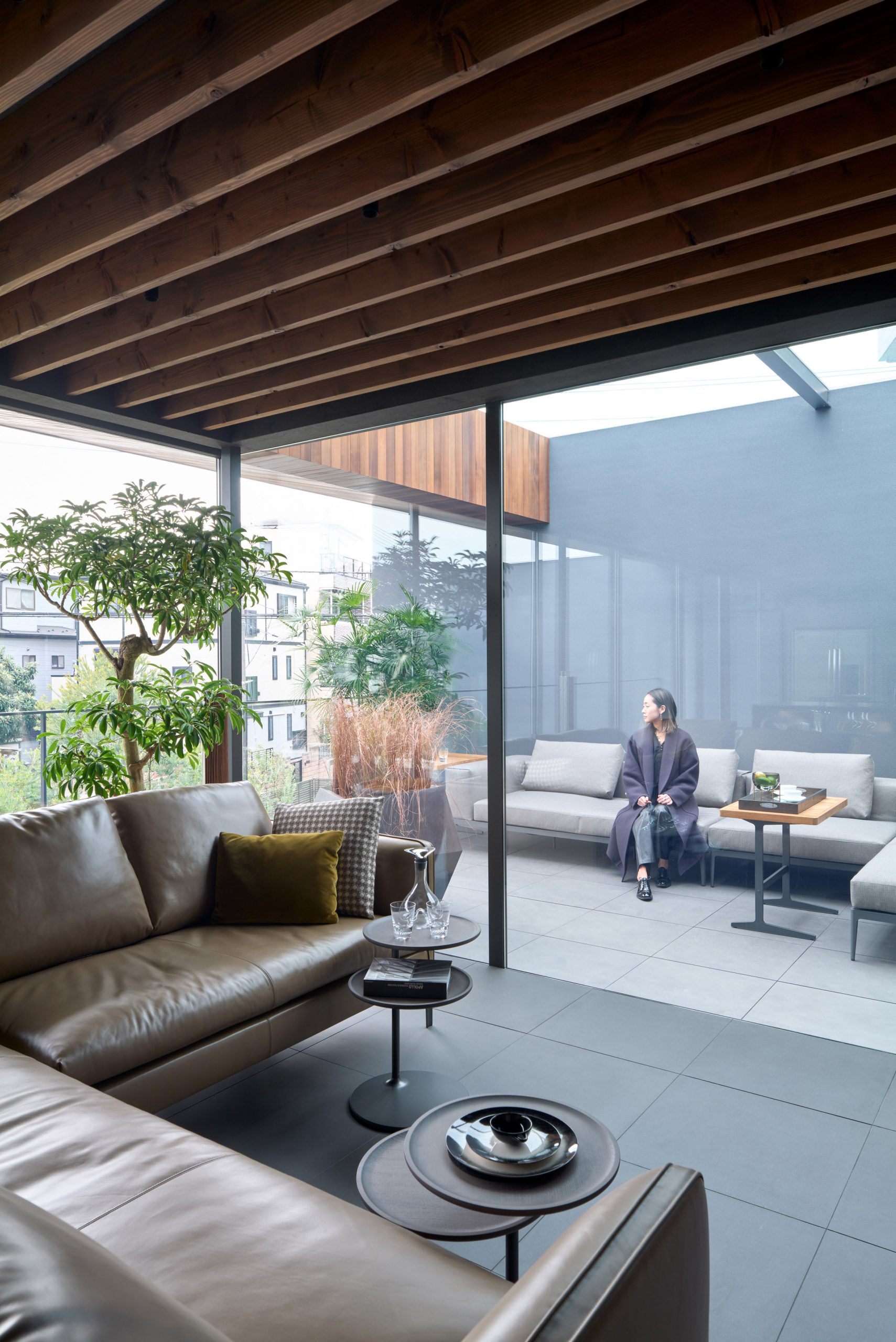 Tiled flooring runs through the interior and exterior by Apollo Architects & Associates