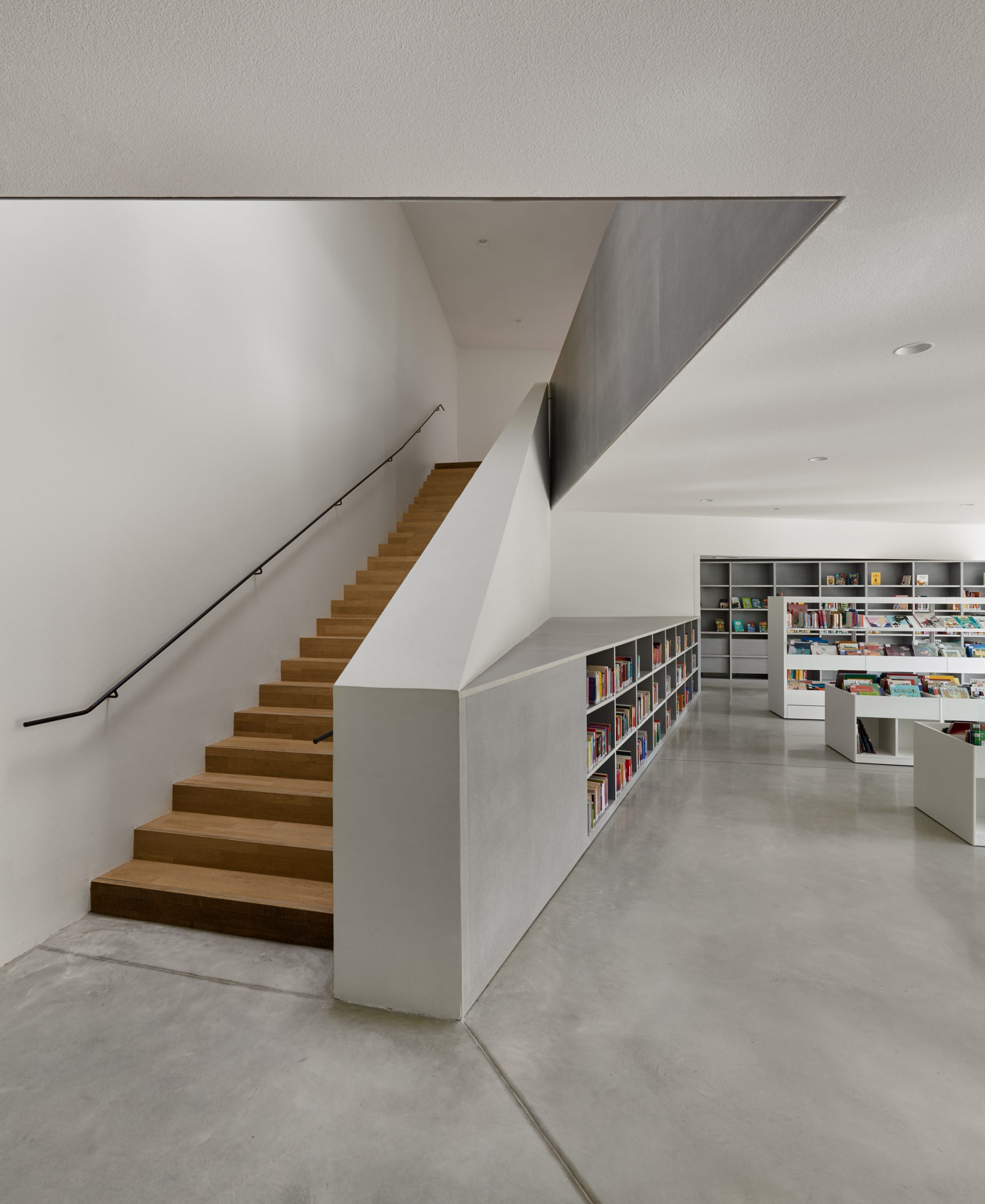Concrete is paired with wooden stairs by Dominique Coulon & Associés
