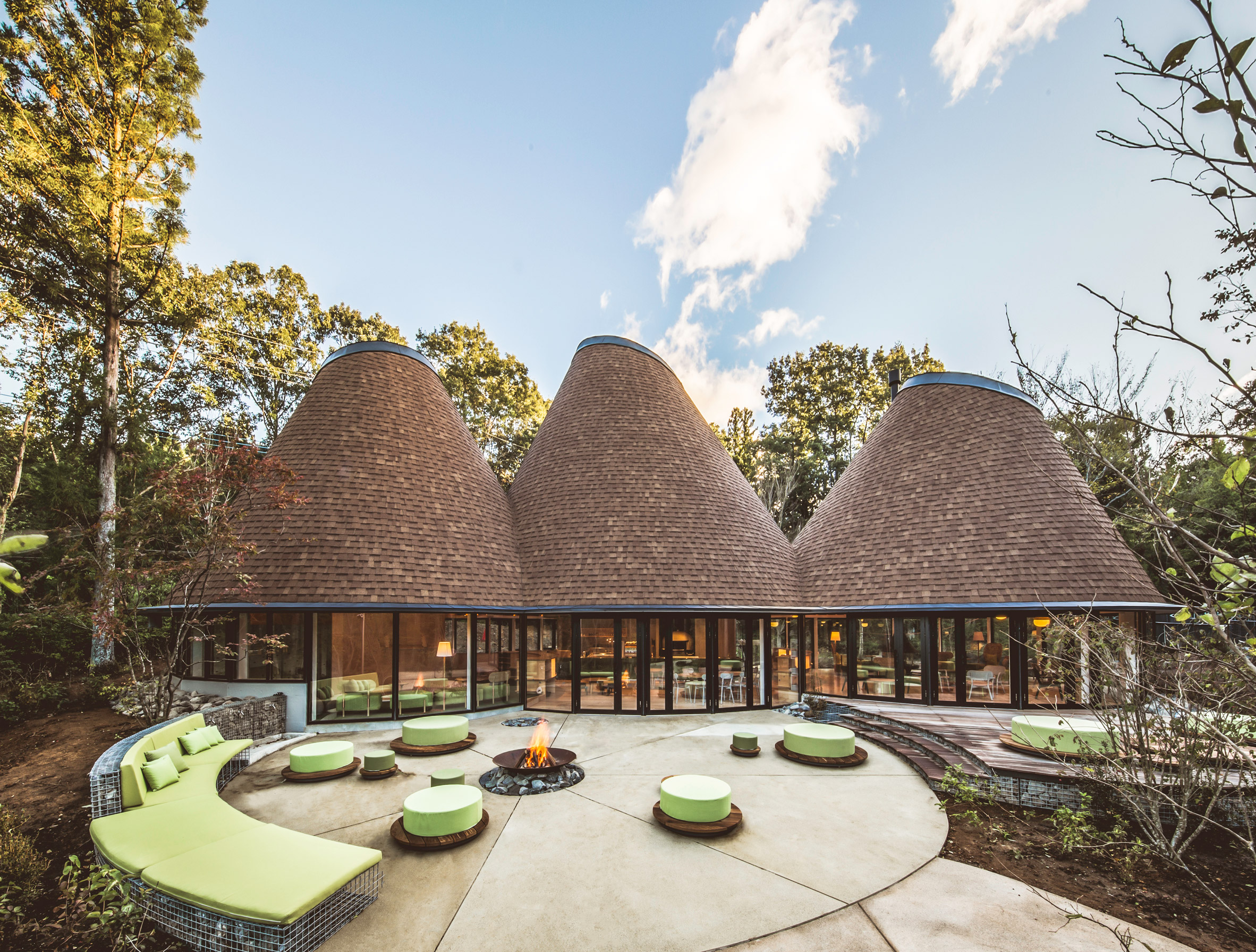 Clubhouse in three timber cones