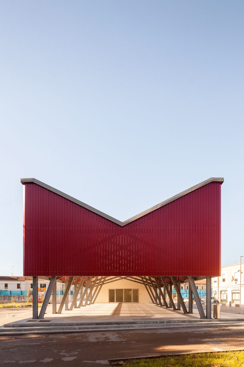 A covered events space with red cladding