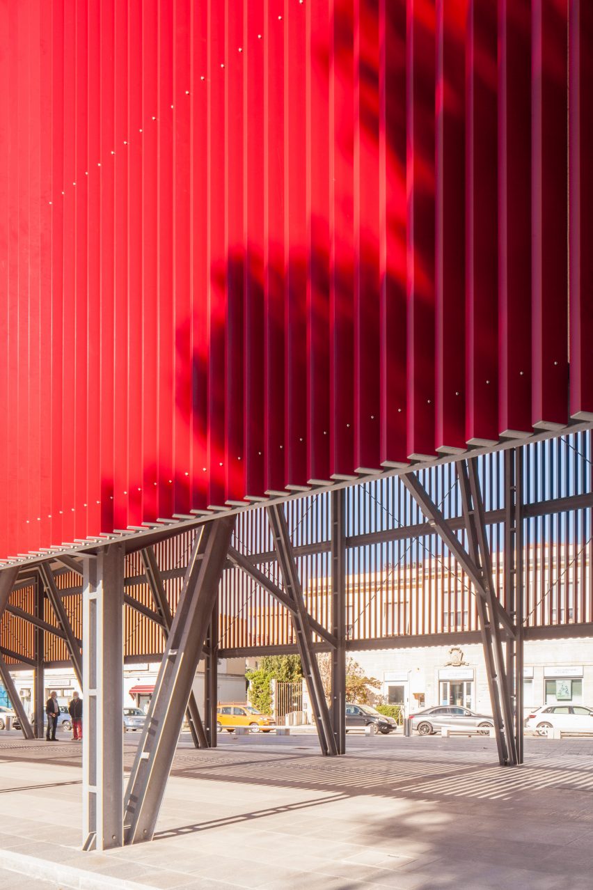 A canopy made with from red slats of aluminium