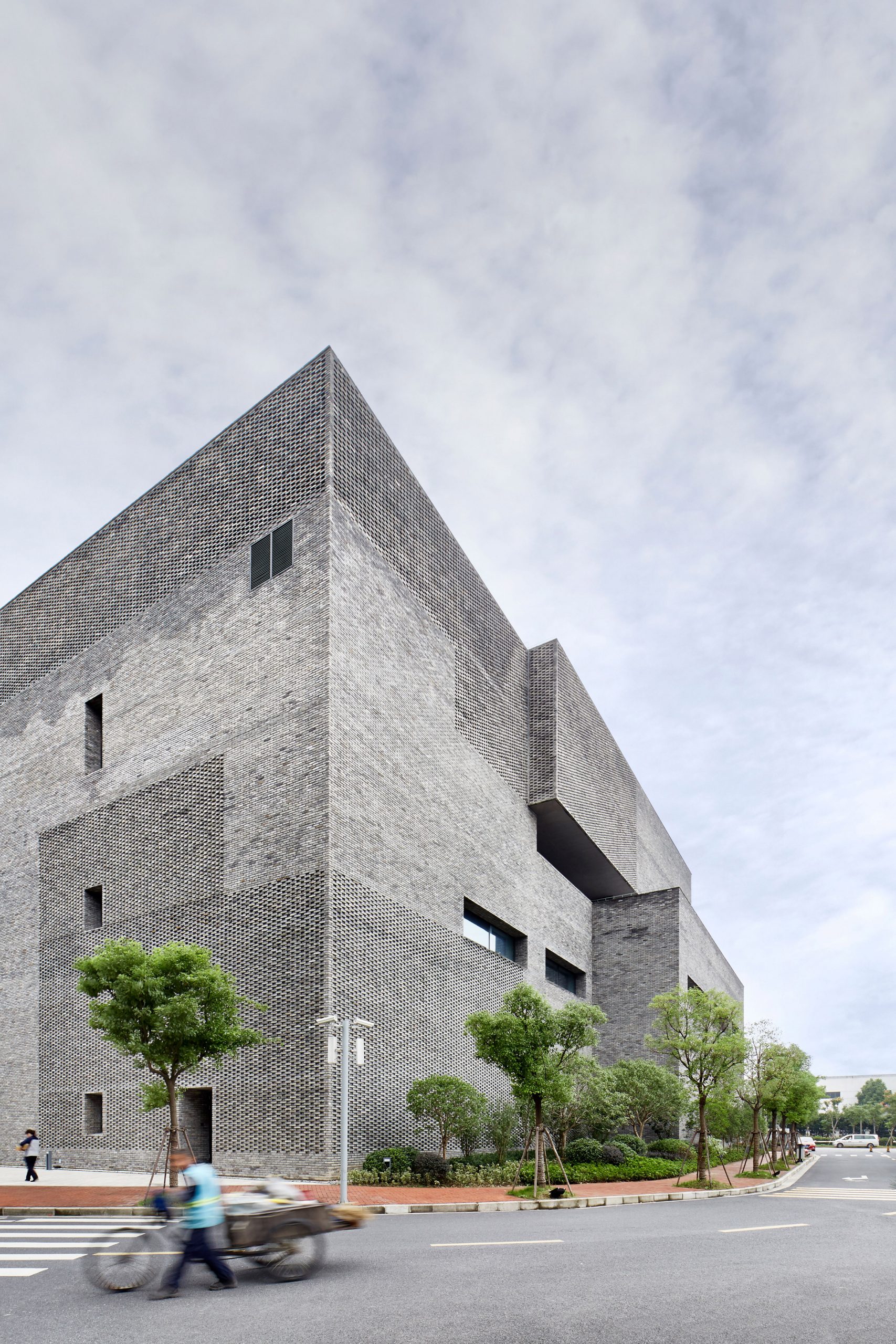 A grey brick research facility at Schindler City campus by Neri&Hu