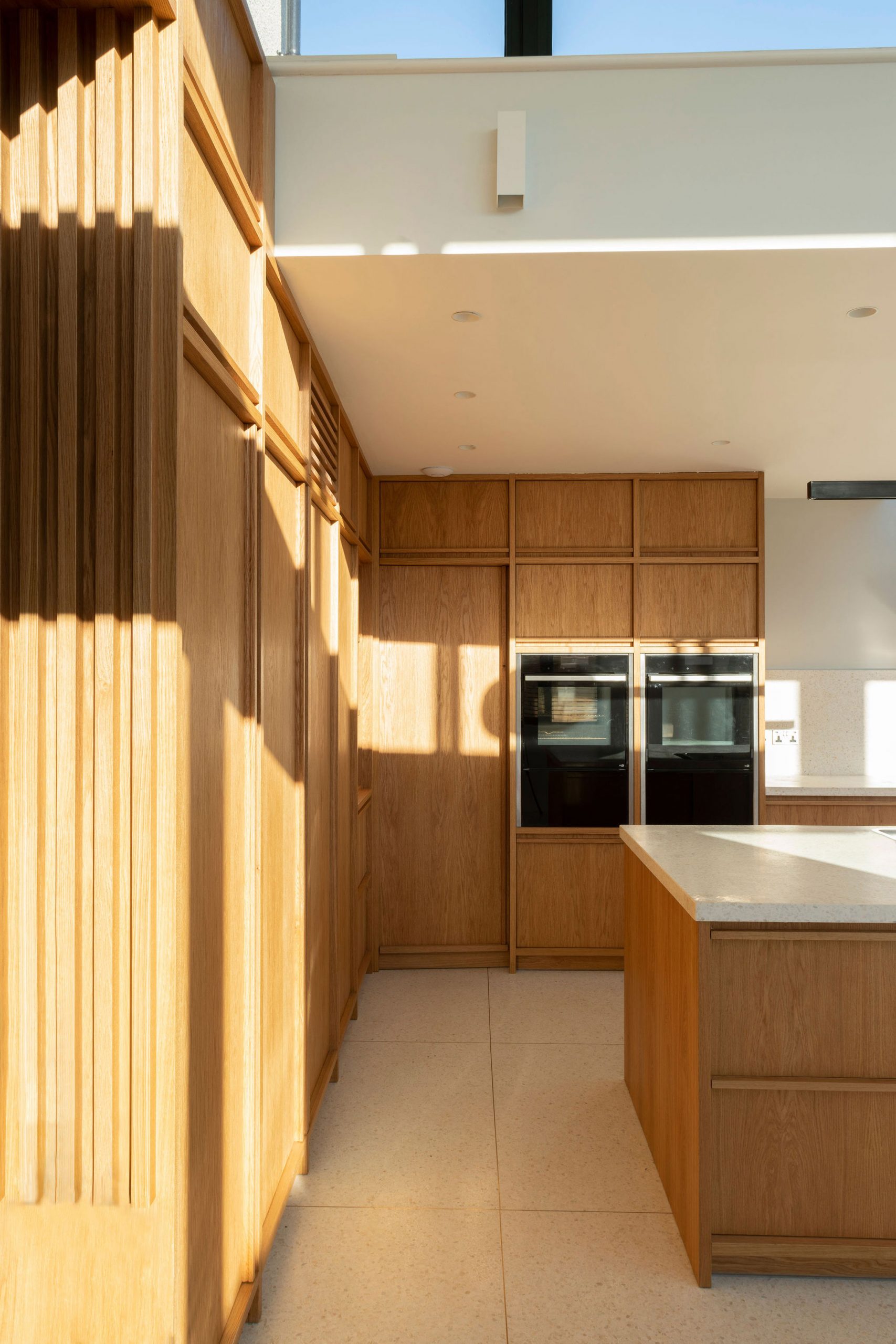 It has wooden cabinetry by Scullion Architects