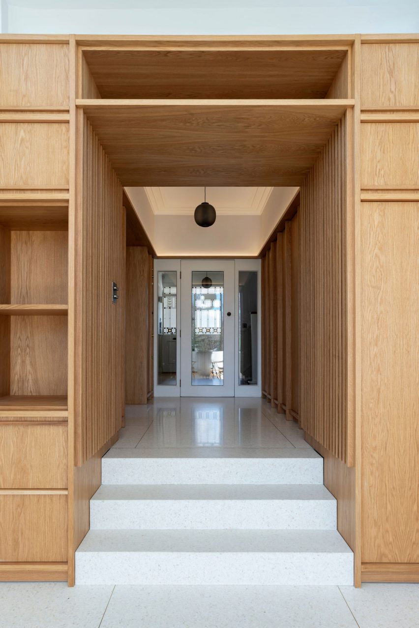Lobby area employs a wood and terrazzo scheme
