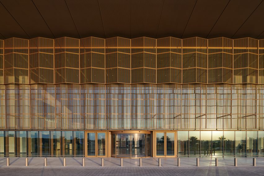 A glazed facade lined with aluminium screens for solar shading