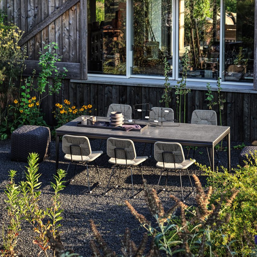 Outdoor dining space among plants in Italy