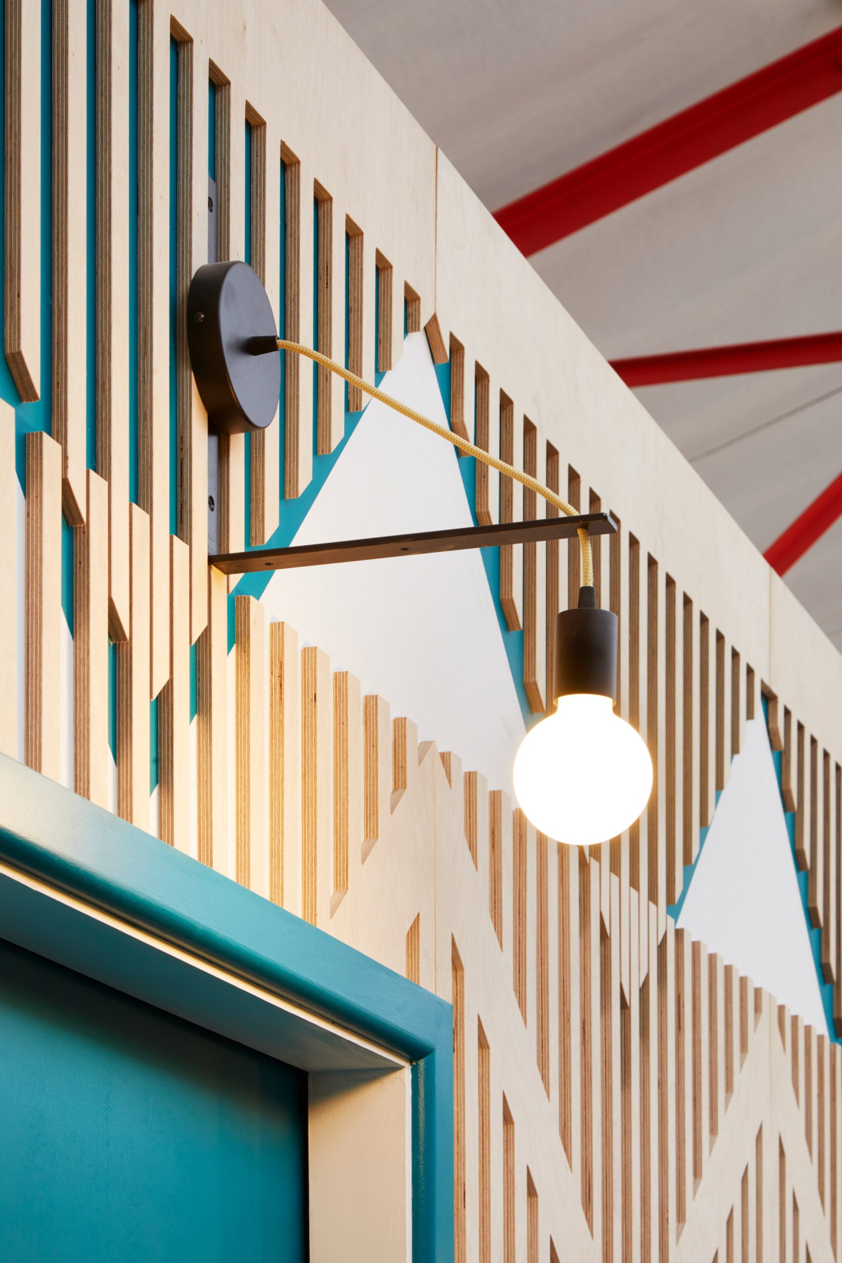 Colourful plywood walls inside a London music studio