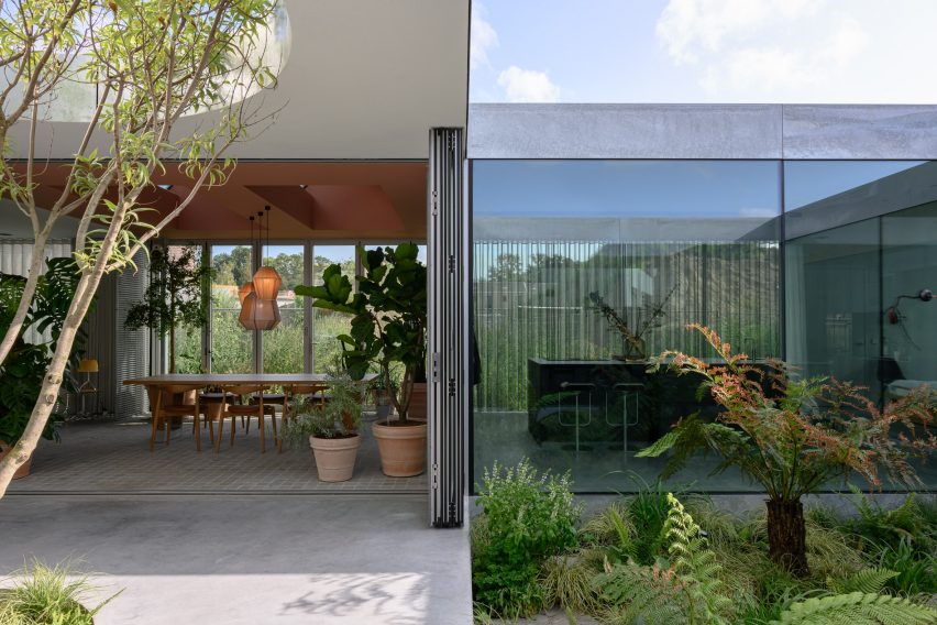 The glass elevation and courtyards of a Dutch family house