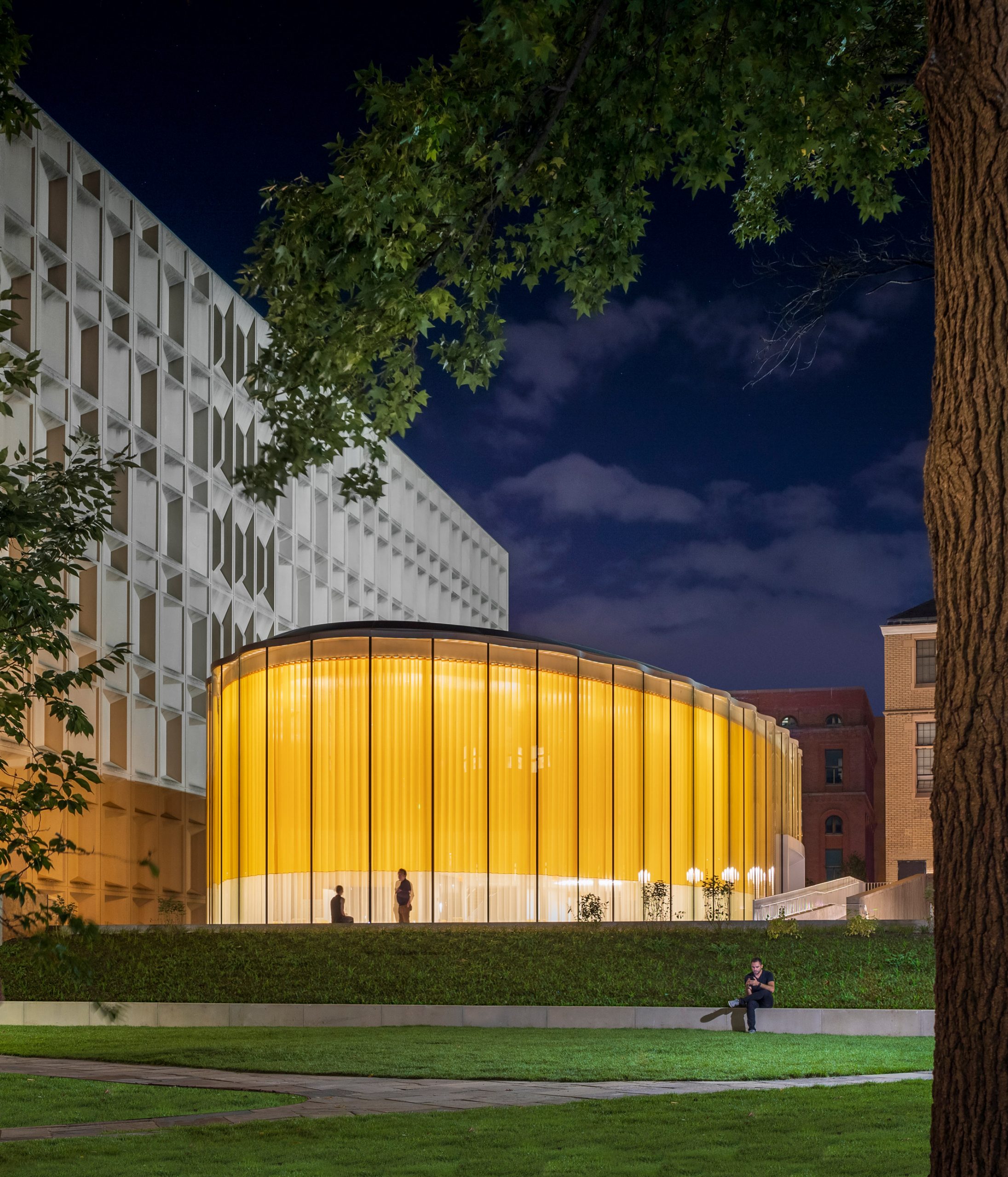 Night time view of student centre by Weiss/Manfredi